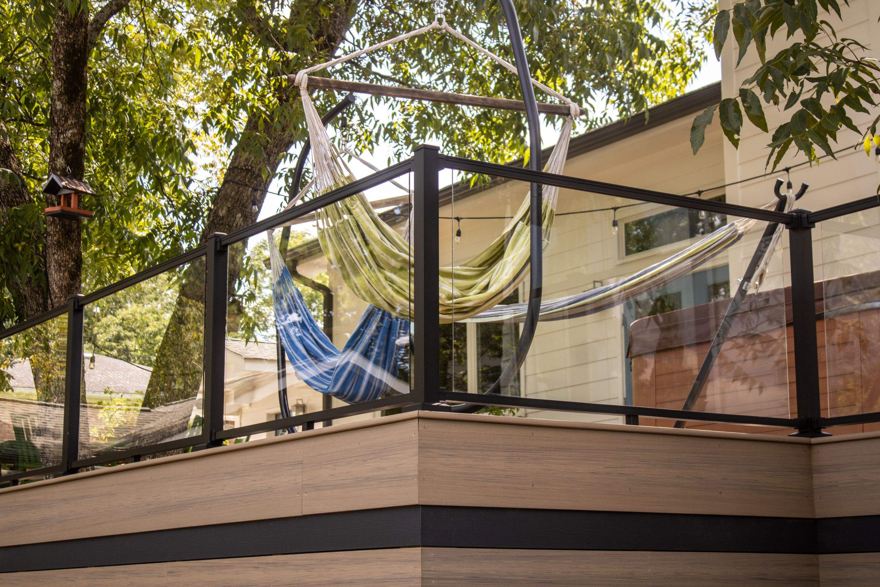 Deck Resurface with Glass Paneling and Deckorators Voyage Series Products by Nelson Exteriors