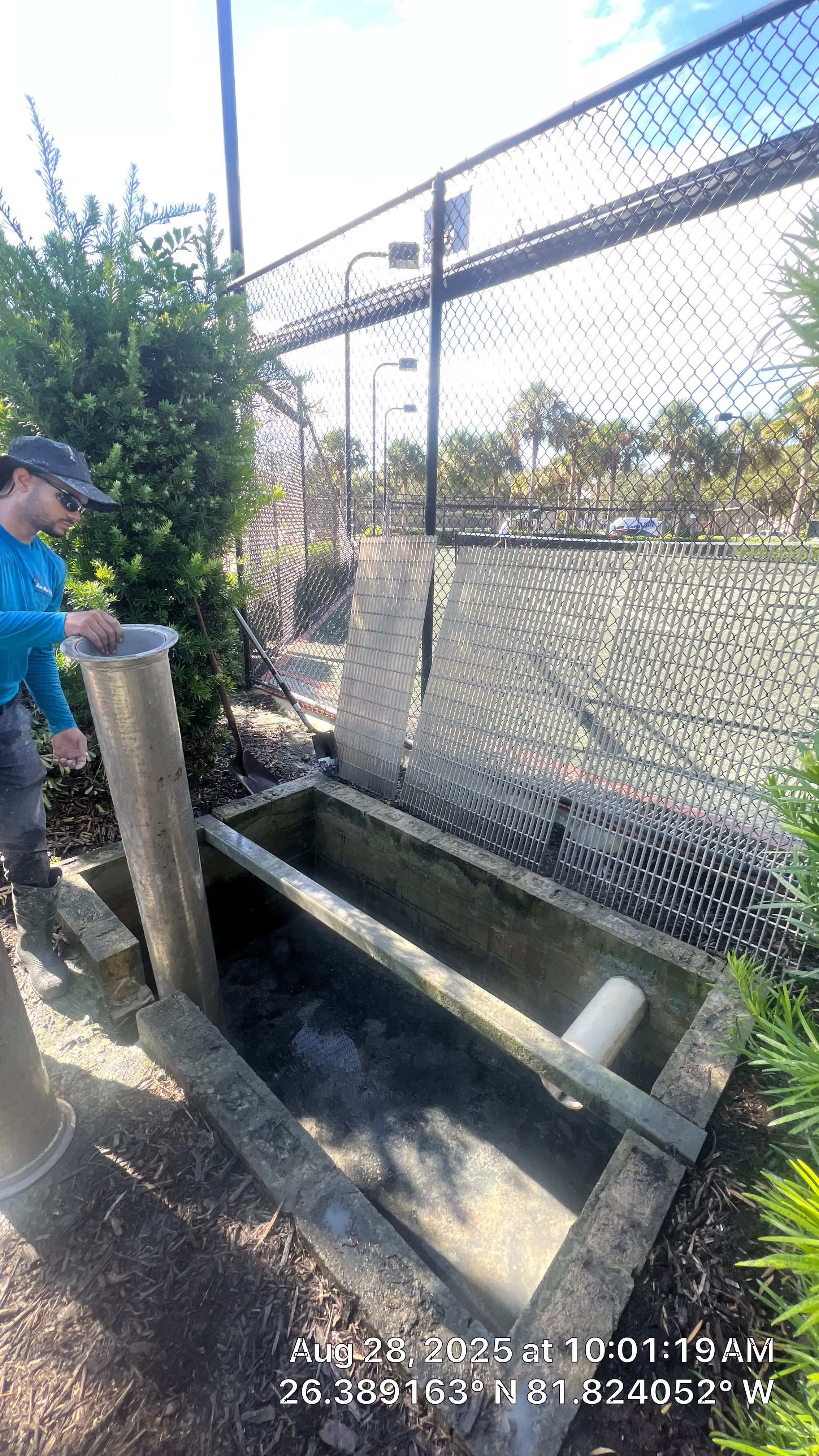 Pelican Landing Tennis Court Catch Basin Cleaning by APS Power & Water
