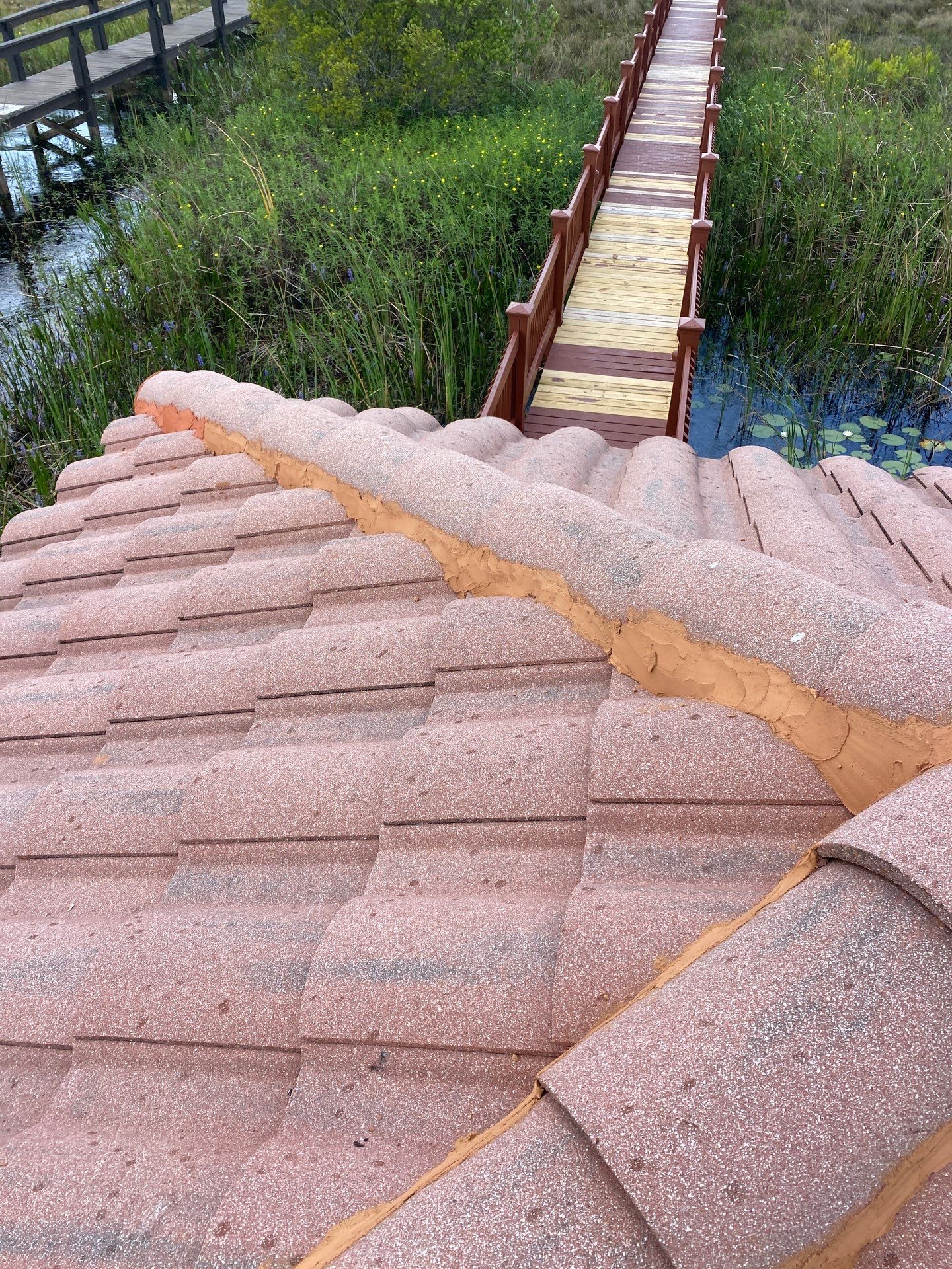Concrete Tile Roof Repair and Ridge Cap Mortar Sealing in Orlando by Tip Top Roofing Co., Inc.