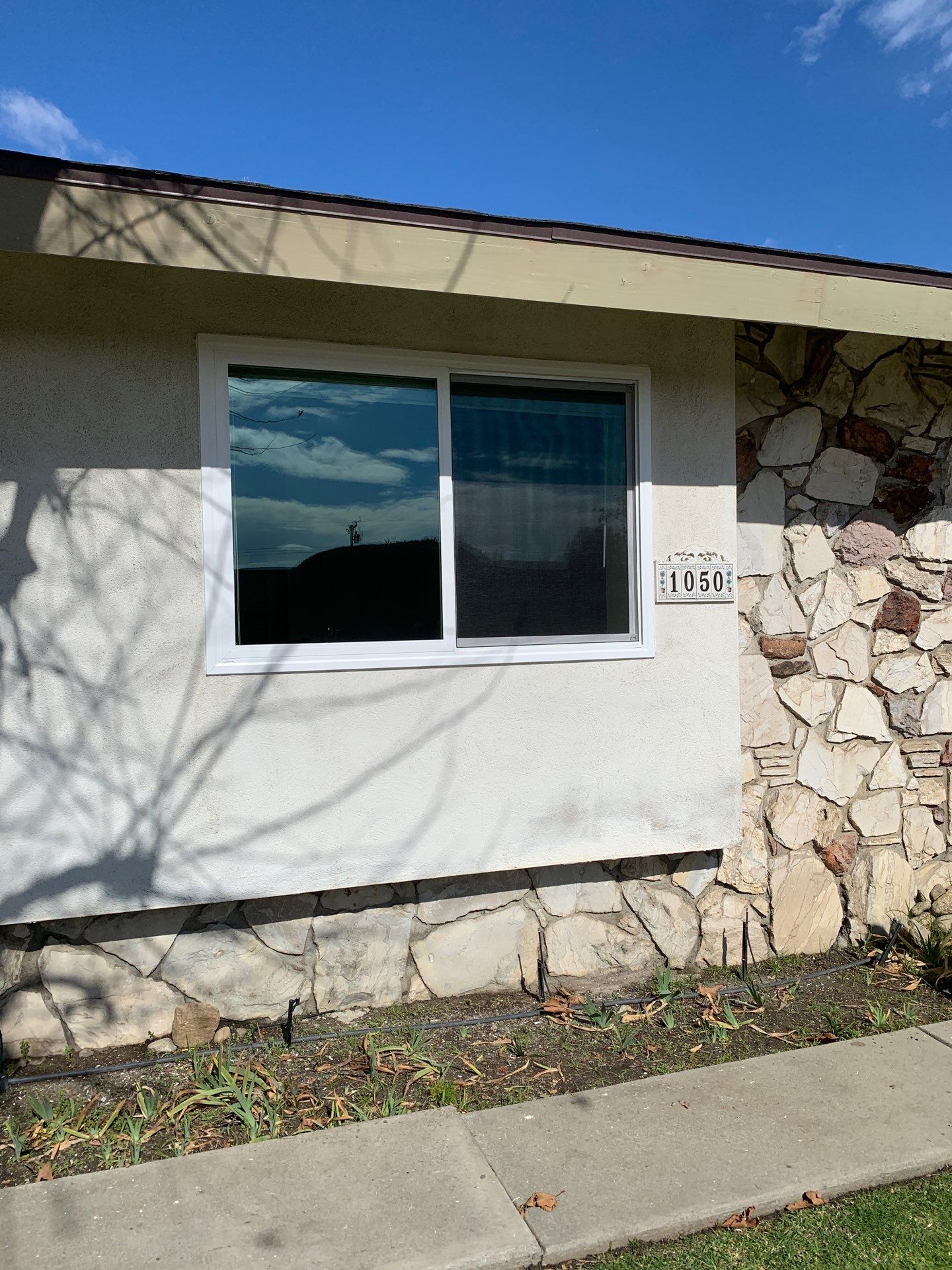 Window Installation using Black Vinyl Windows by American Window Company