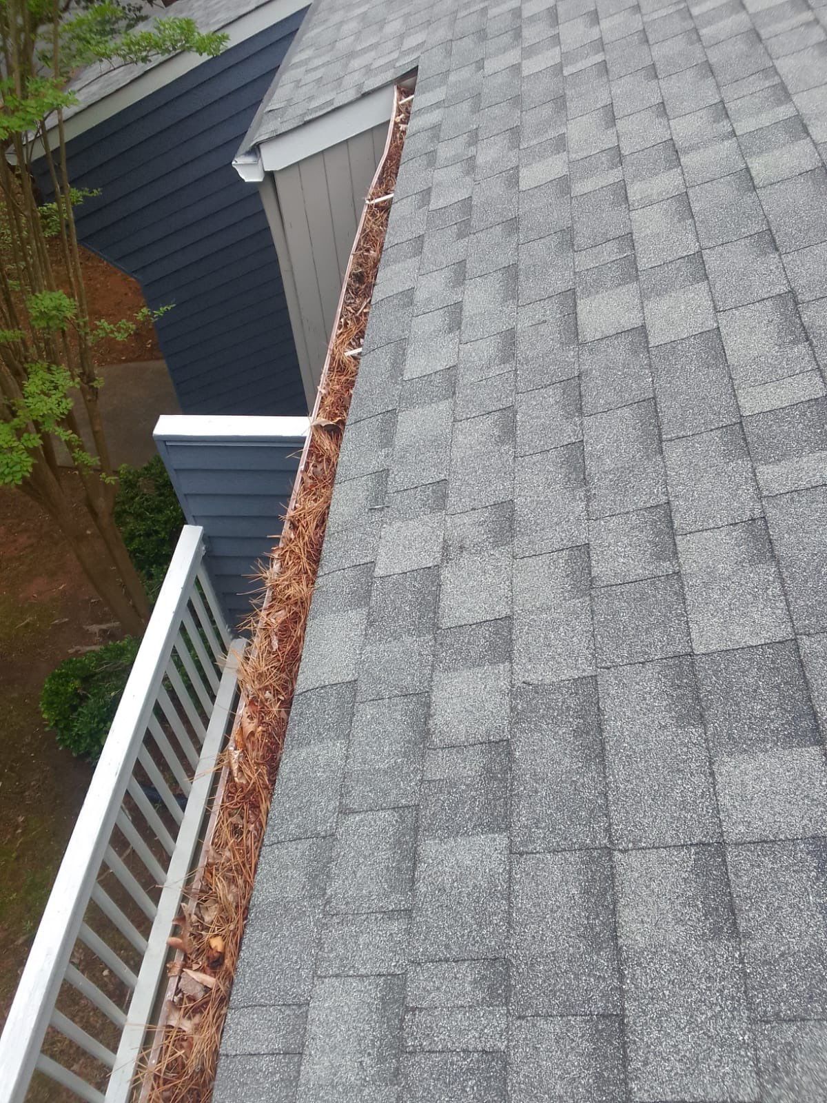 Commercial gutter cleaning Durham, NC before photo with filled gutters