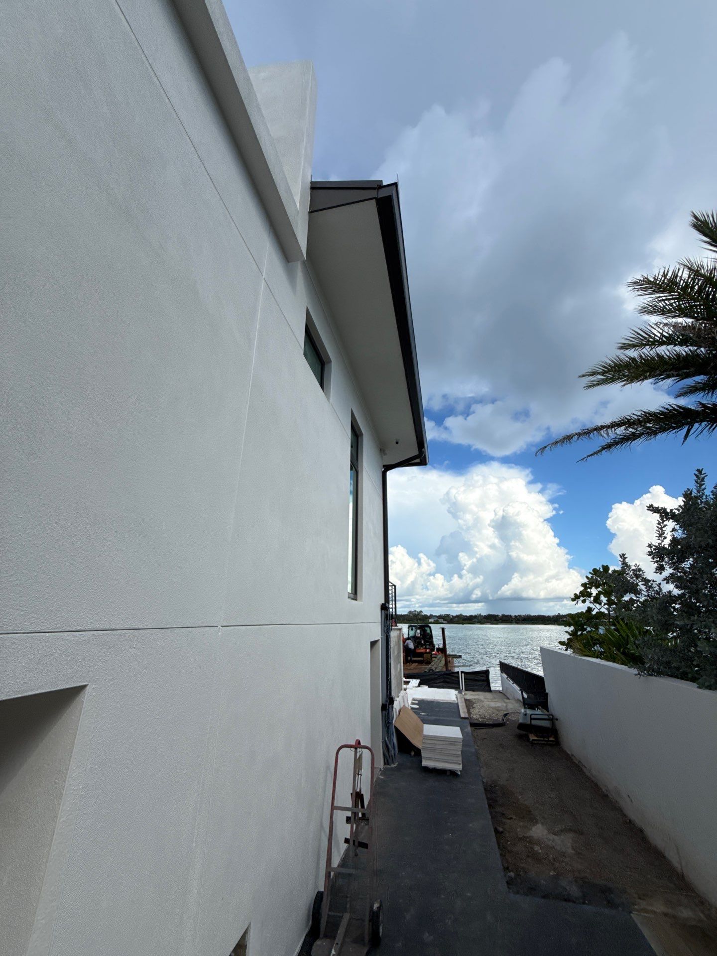 Seamless Aluminum Gutter Installation using black seamless gutters in Sarasota FL by Gutter Professors