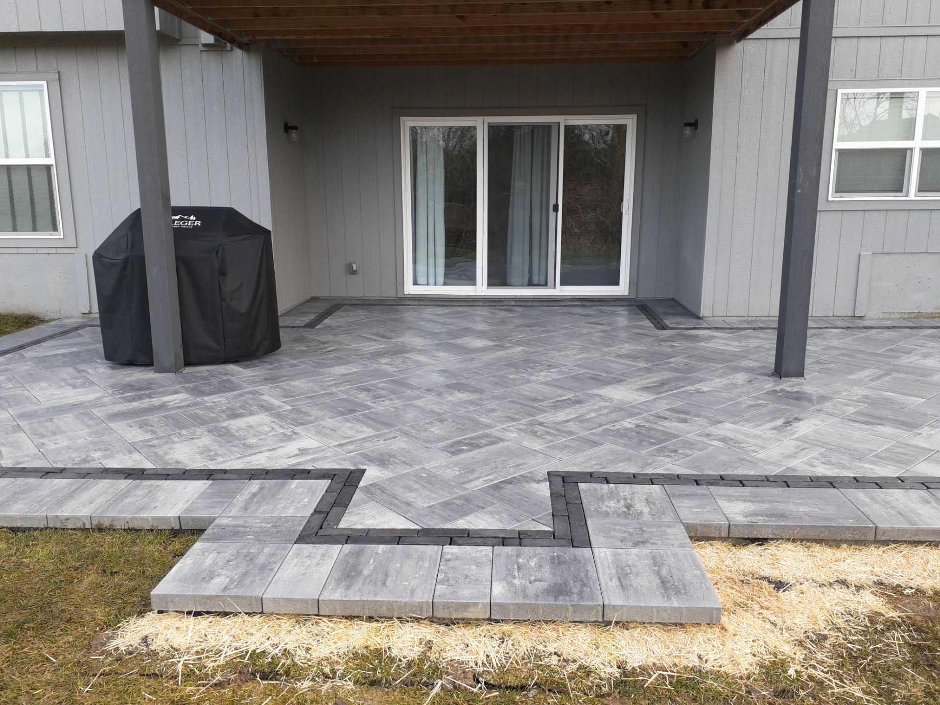 Back Yard Paver Patio by LAND ESCAPES LLC