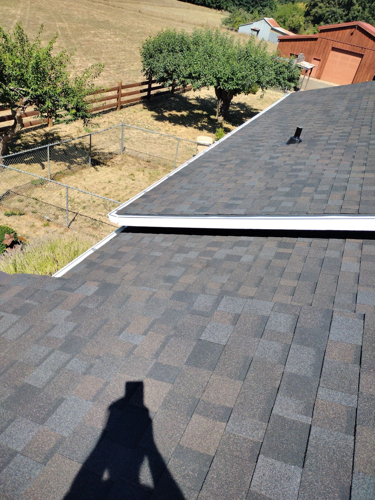 Residential Roof Replacement with Metal Accents by Orezona Building & Roofing Company, Inc.