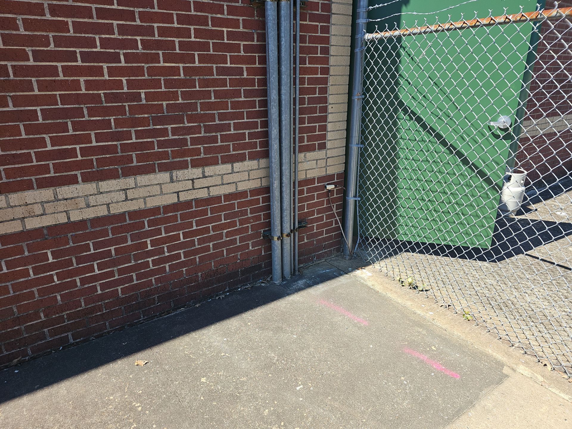 Utility Locating at a school for fence install by Alsip Locating Service, LLC