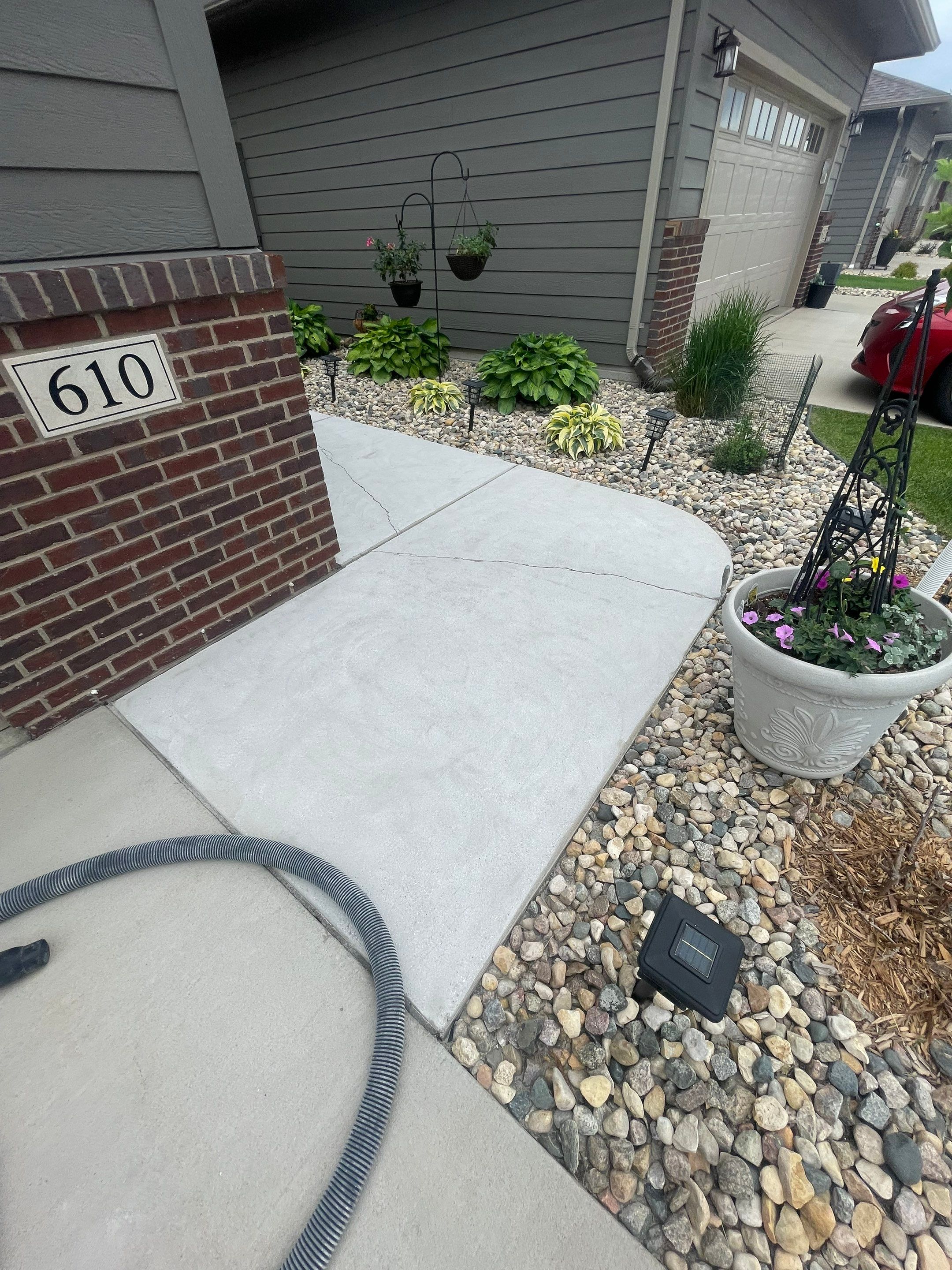 Custom Concrete Coating for Sioux Falls Patio and Front Walkway by Select Painting, Coatings & Garage Cabinets