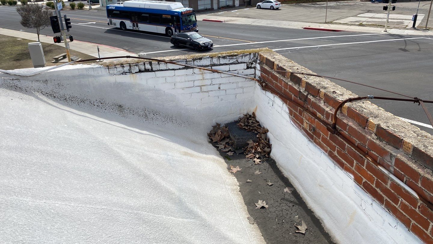 Polyurethane foam roof refurbish and recoating by Straight Edge Roofing Inc