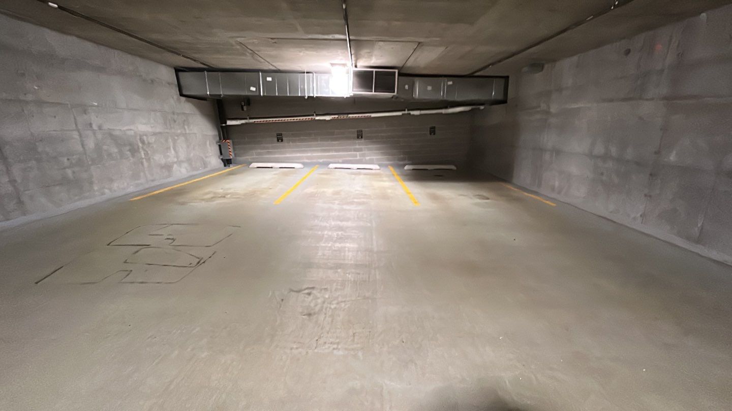 Parking garage using Hot water by Northern Power Washing LLC.