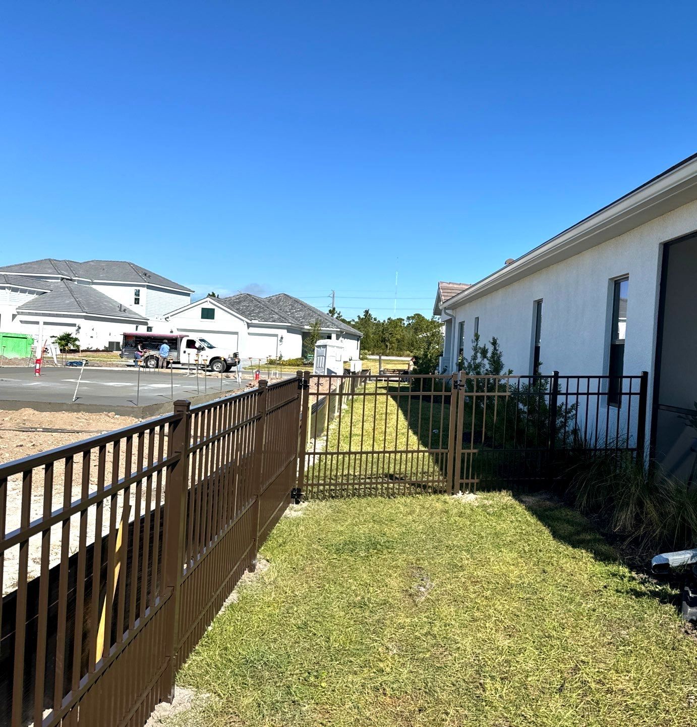 Aluminum Fence Installation using 4Ft 3 Rail Bronze Puppy Picket Aluminum Fence by Asap fence and gates, LLC