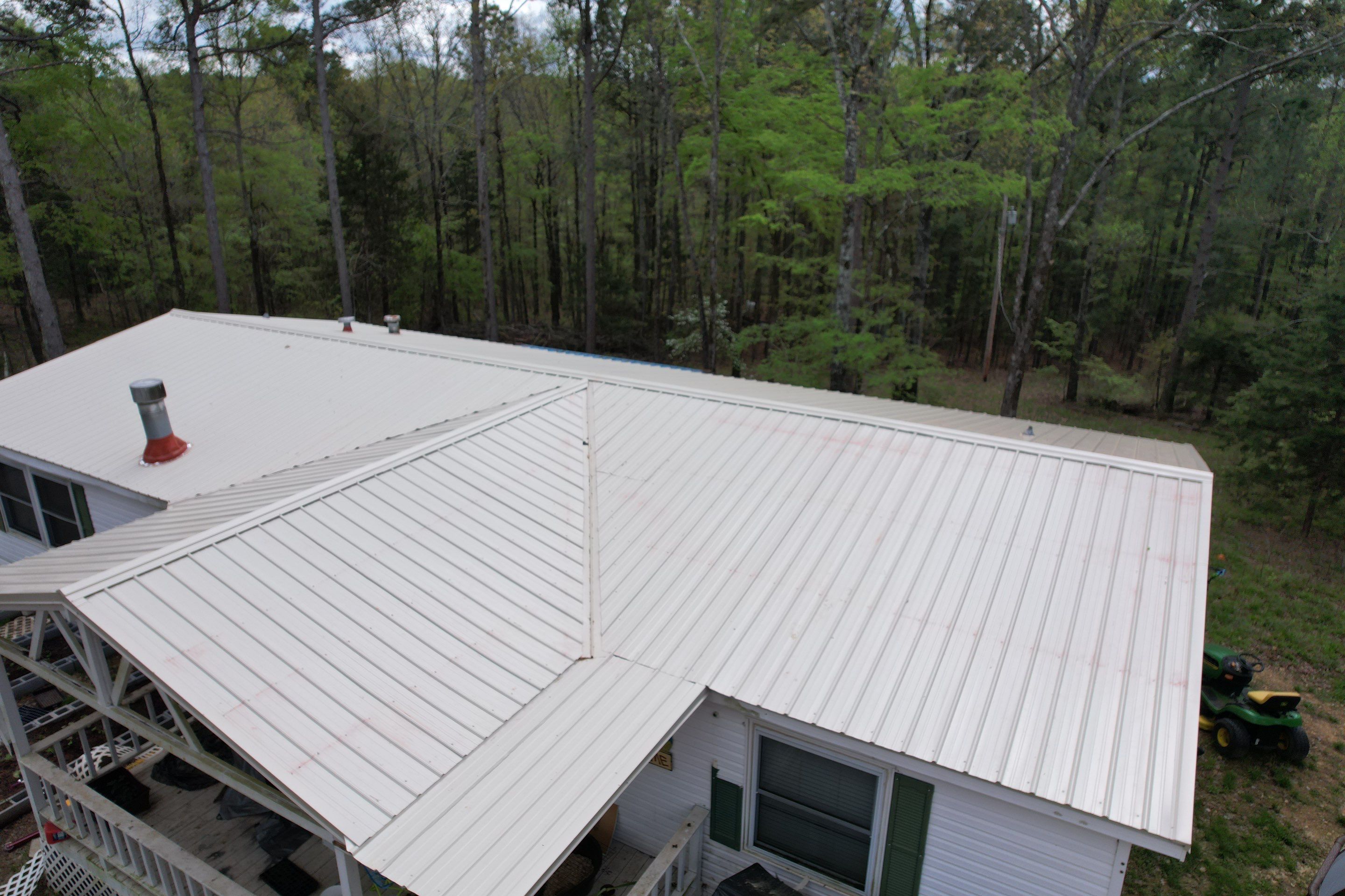 Residential Roofing Installation using 26 Gauge Colored Panels by Hostetler Roofing