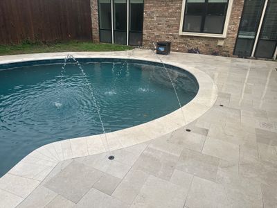 Freeform Pool Remodel with Travertine Deck and Deck Jets