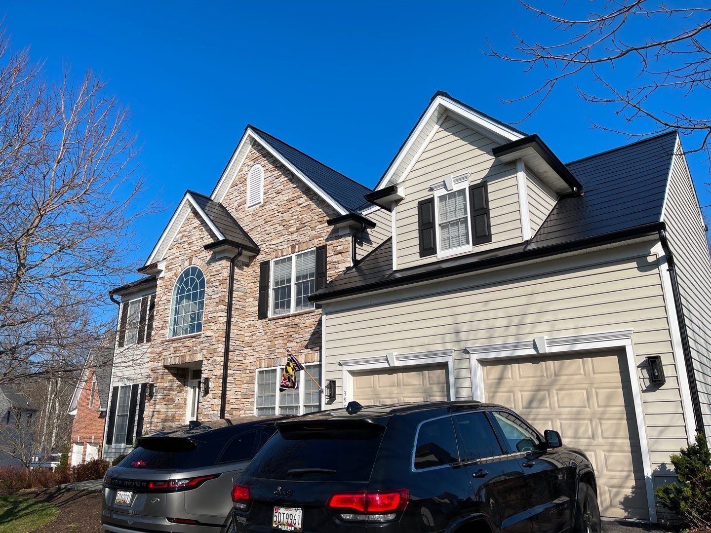 Tesla Solar Roof and Gutter Installation by American Home Contractors