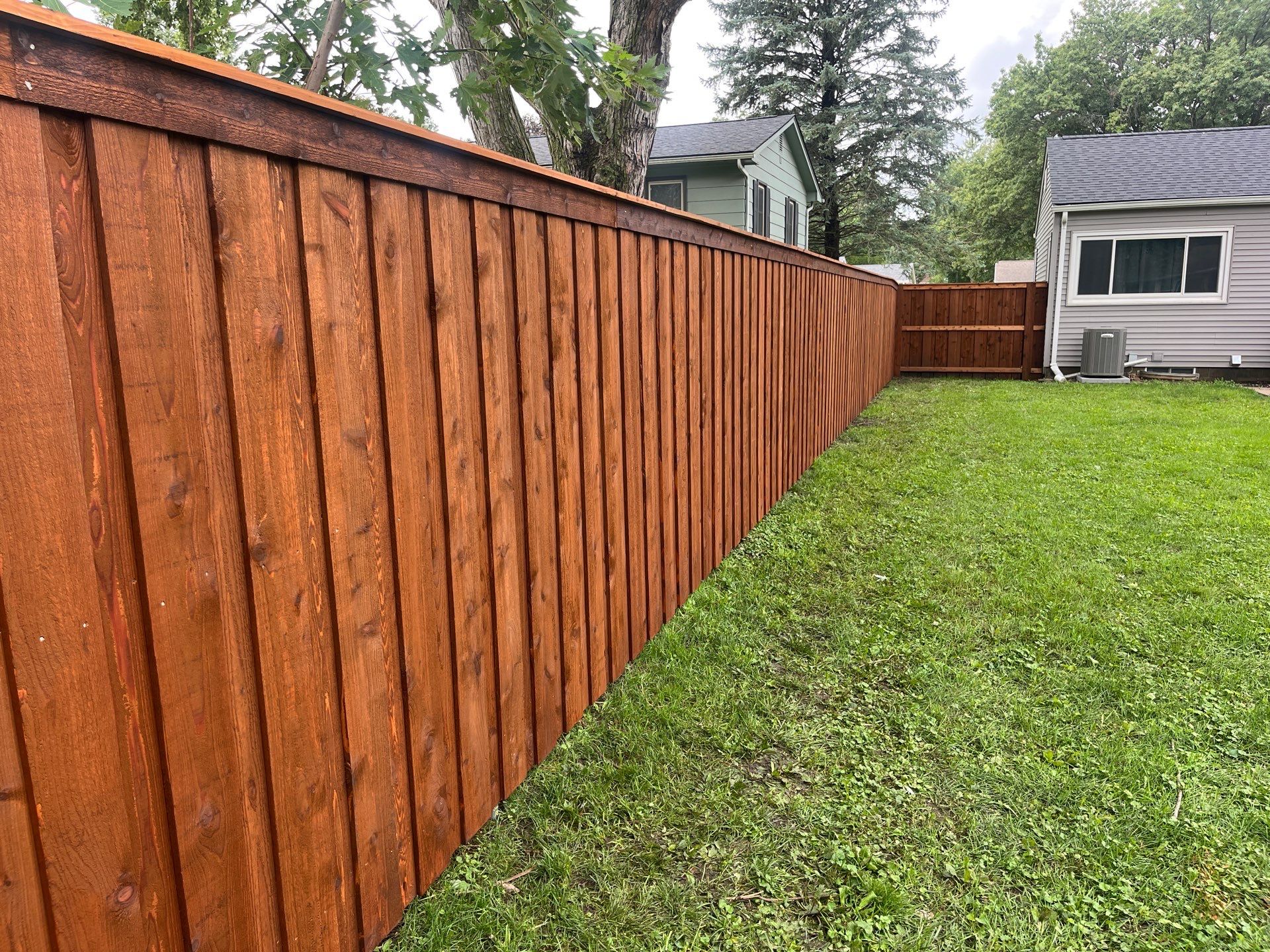 Board on Board Wood Privacy Fence Installation in Cedar Falls by Perfect Picket Fence and Stain