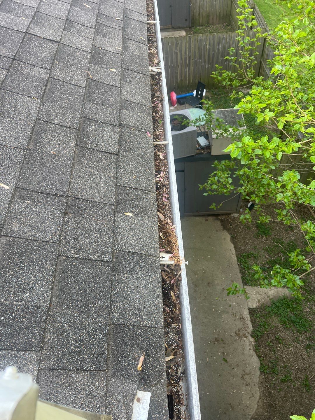 Commercial gutter cleaning Louisville before photo with filled gutters