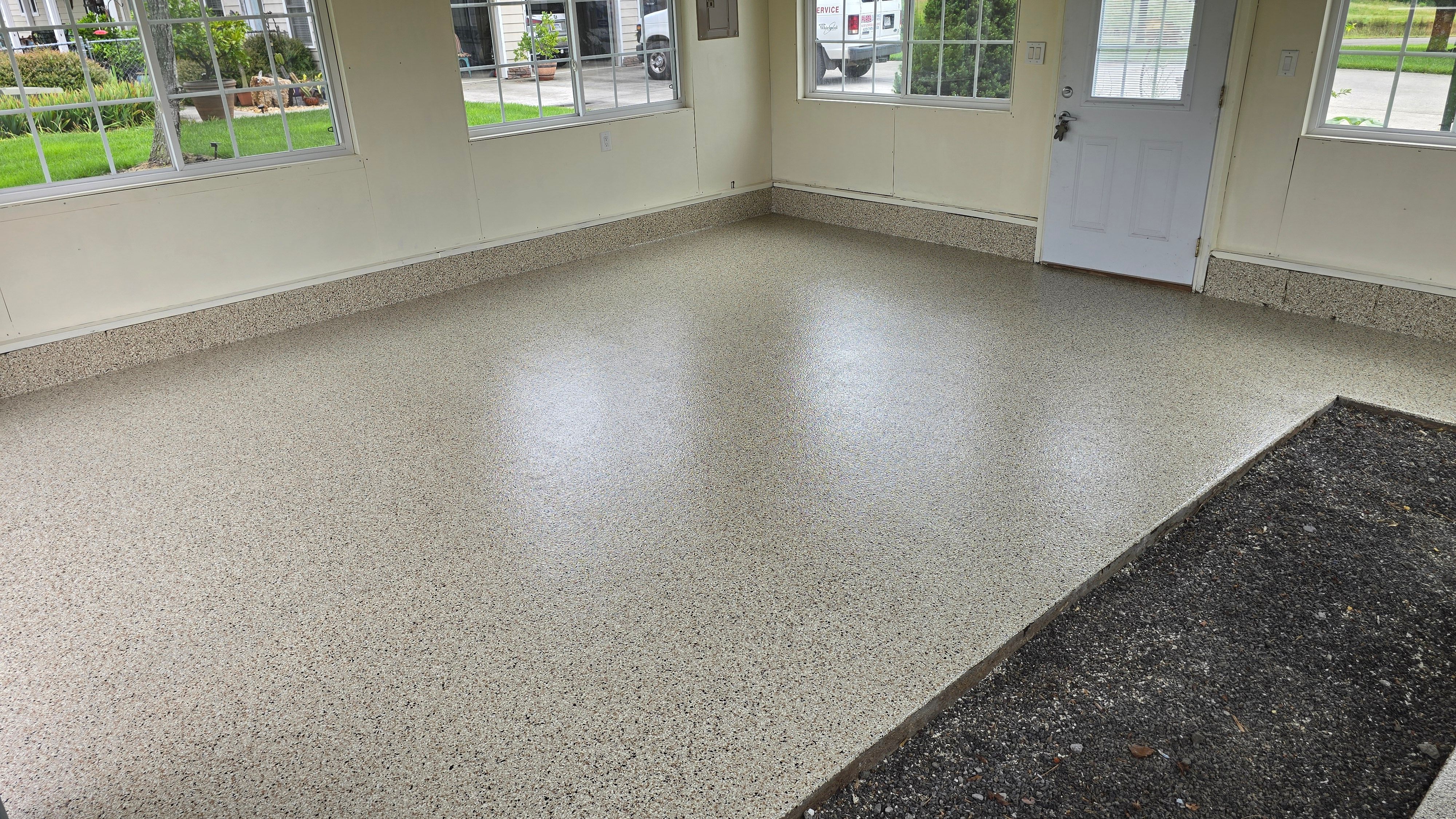 Two garages completed using Shoreline and Midnight by Elite Floor Solutions