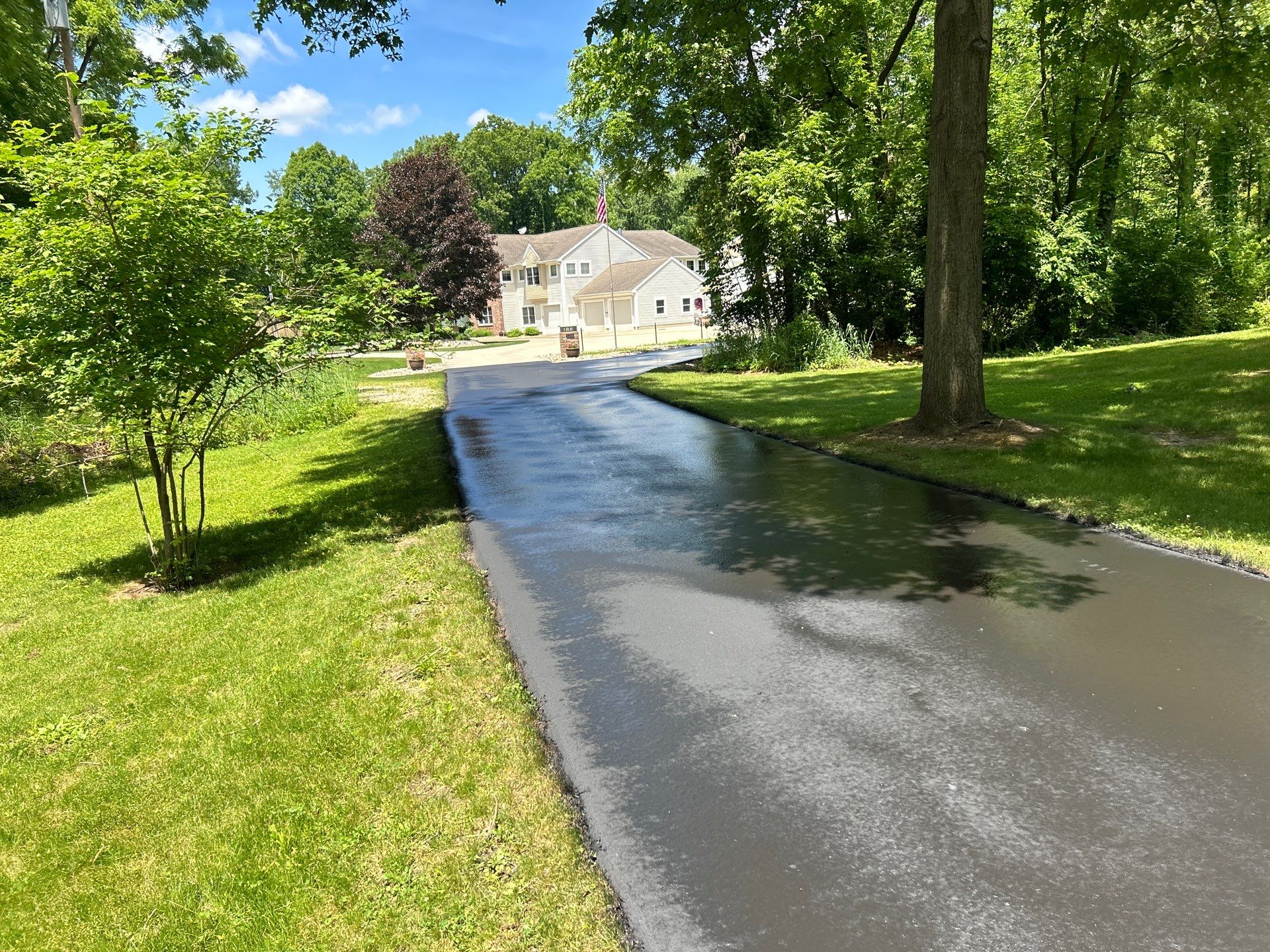High end residential driveway by Quality Asphalt & Maintenance LLC