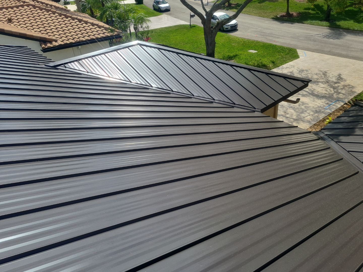 Residential Roofing Installation using 1" Nail strip metal roof by BLUES BROTHERS CONSTRUCTION CORP