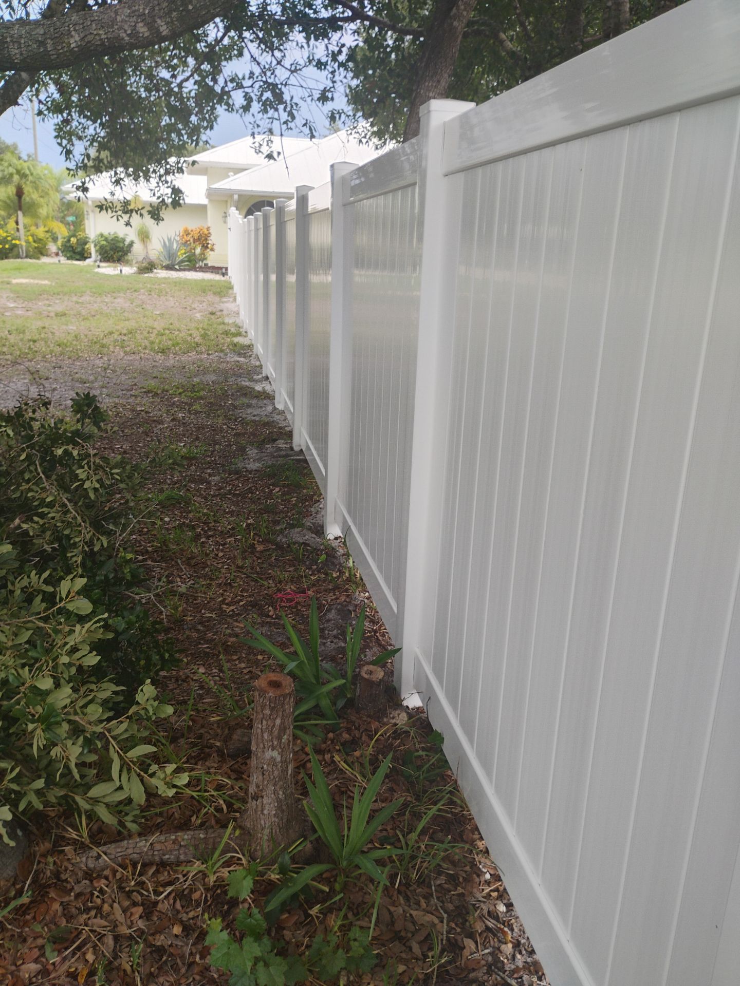 White Vinyl Privacy Fence Installation and Gate Assembly in Punta Gorda by True Fence LLC