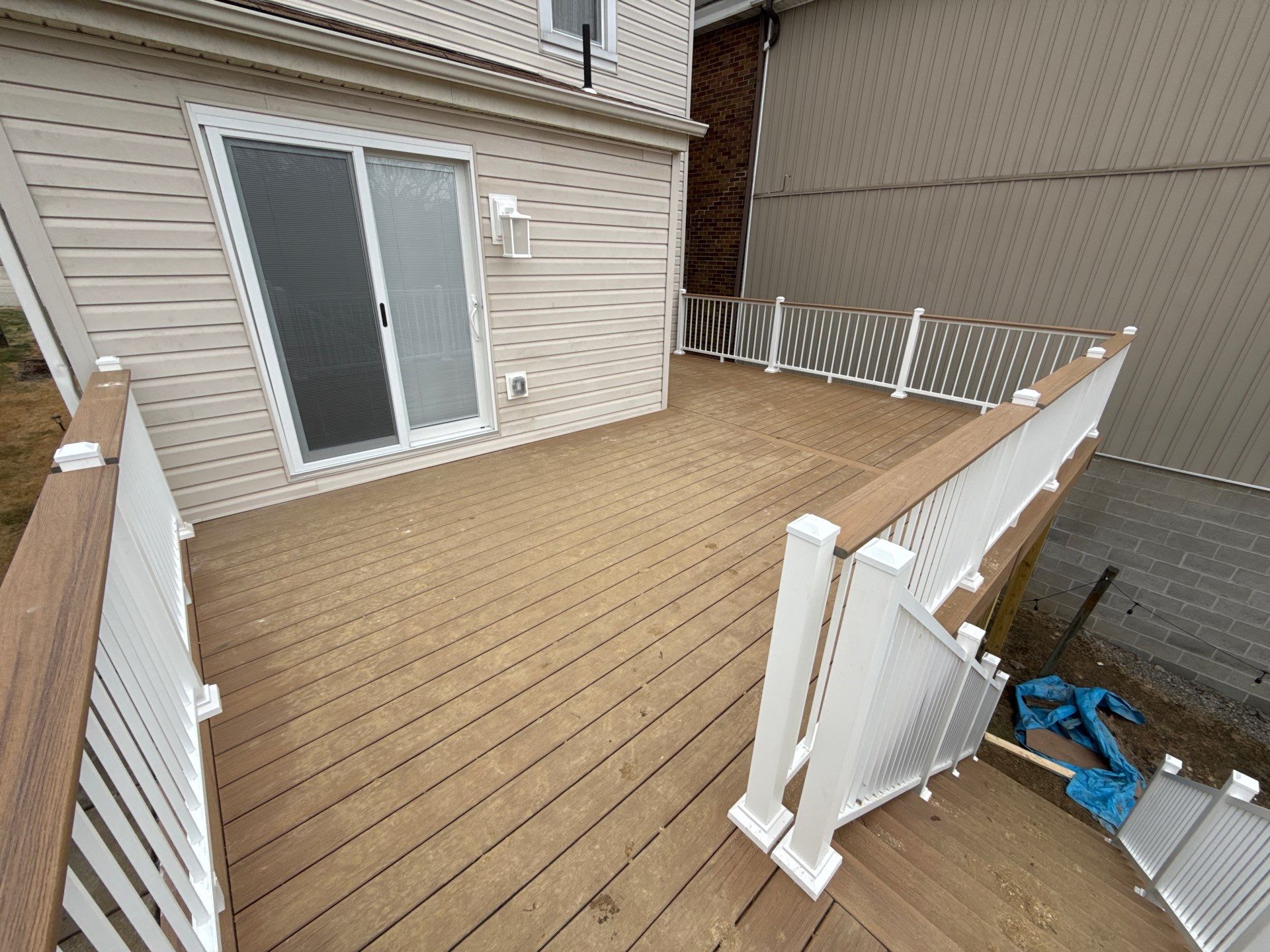 Deck and door by Cousins Roofing Siding & Decks
