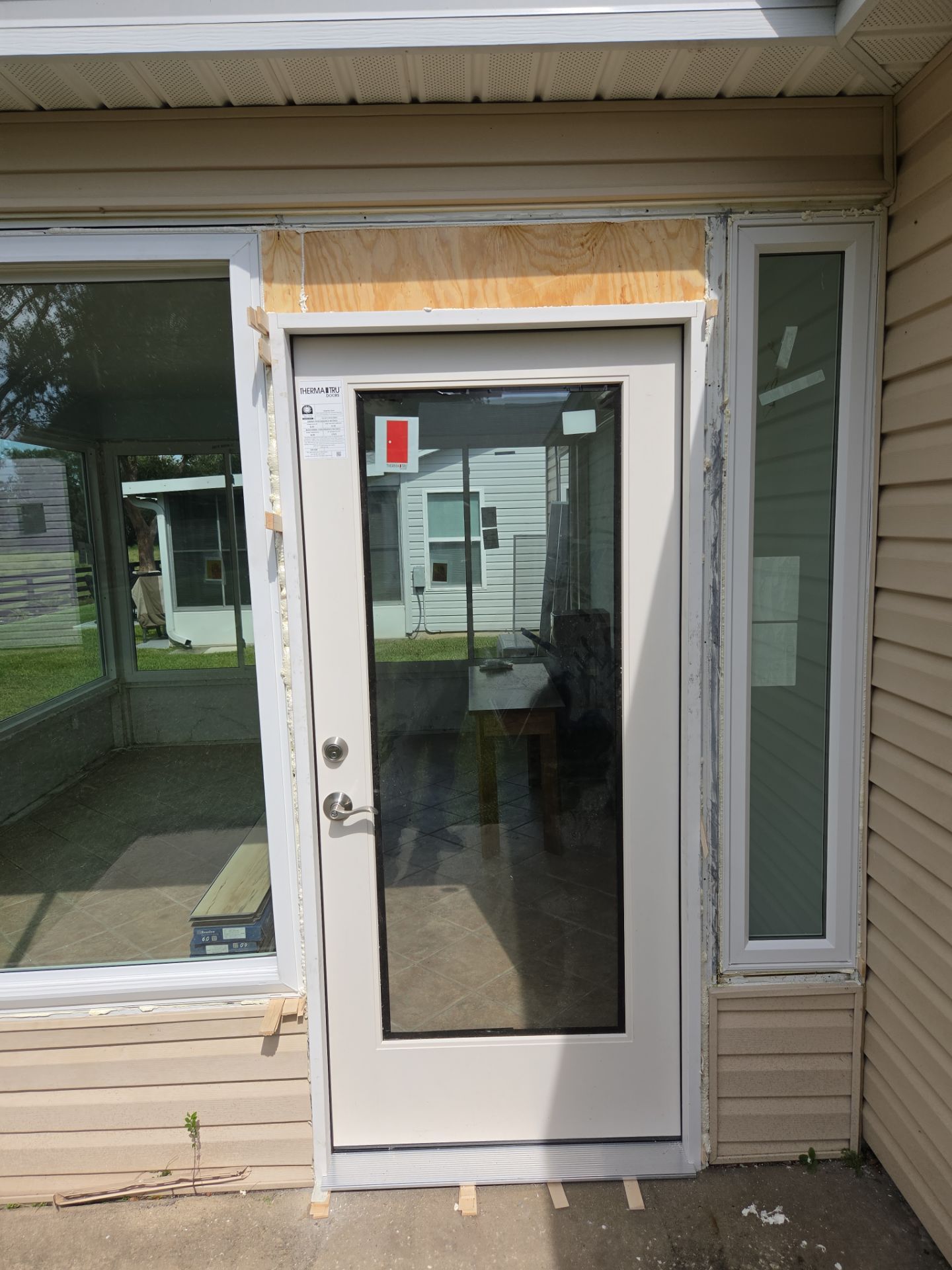 Sunroom Conversion with Alside Windows and Provia Door in The Villages by Windows & Doors Store