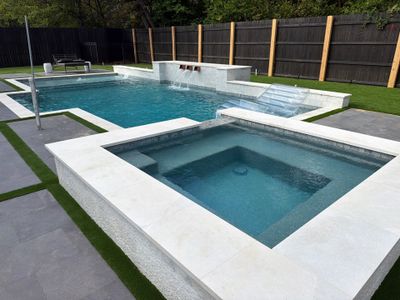 Modern Geometric Pool with Raised Spa and Sheer Descents