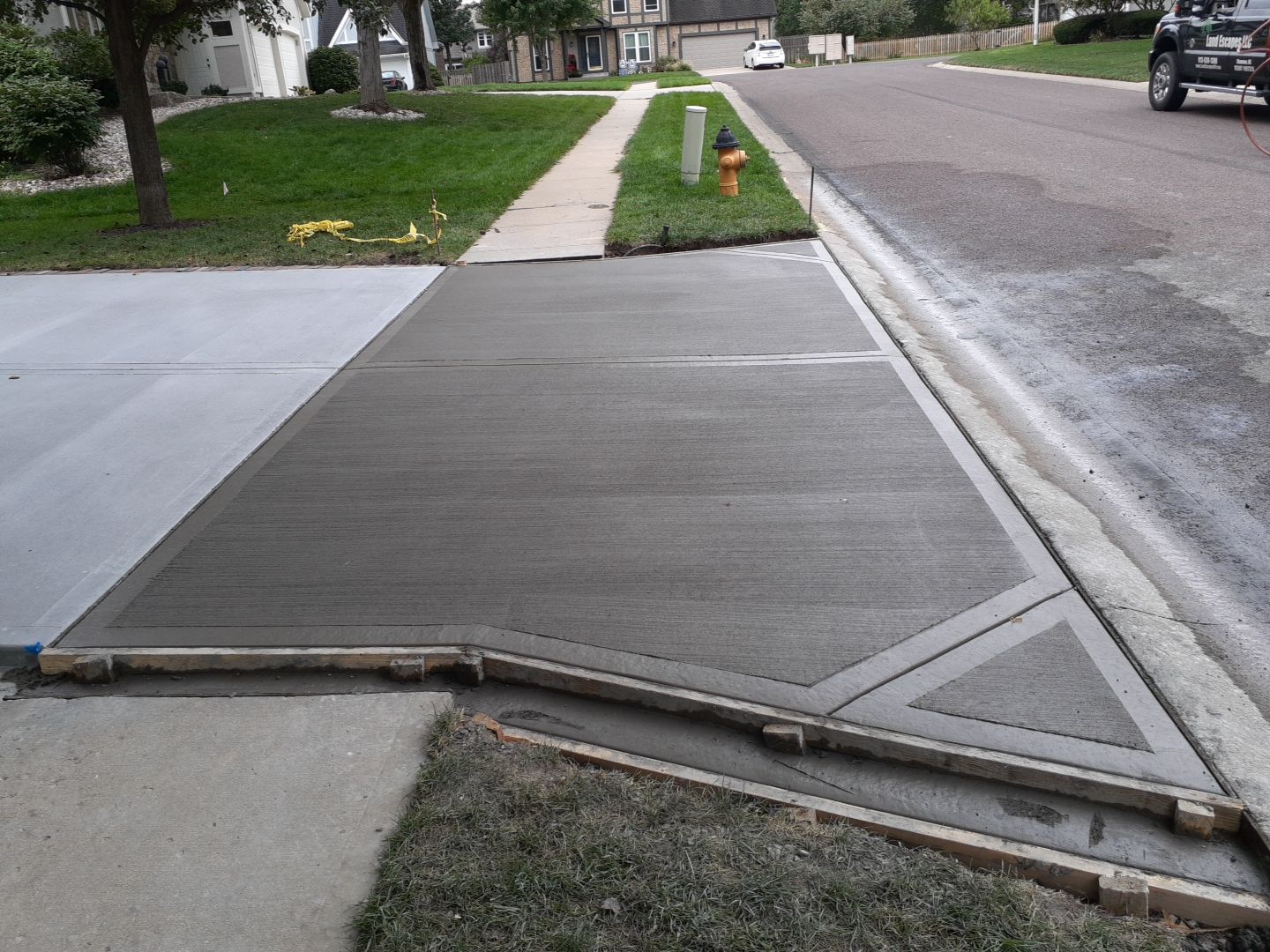 New Driveway and Sidewalk by LAND ESCAPES LLC