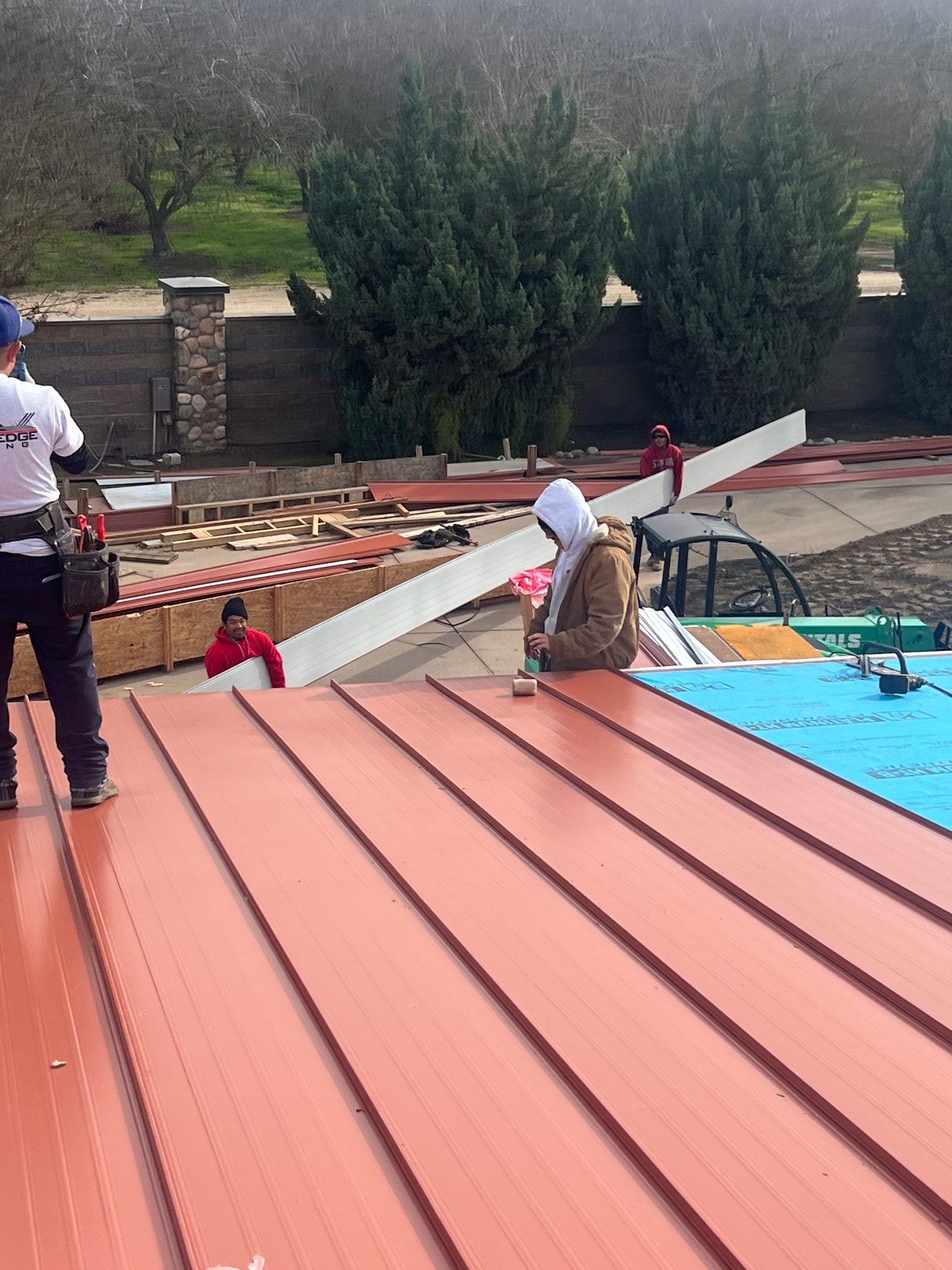 Tile, Metal, and TPO roofing project (new construction) by Straight Edge Roofing Inc