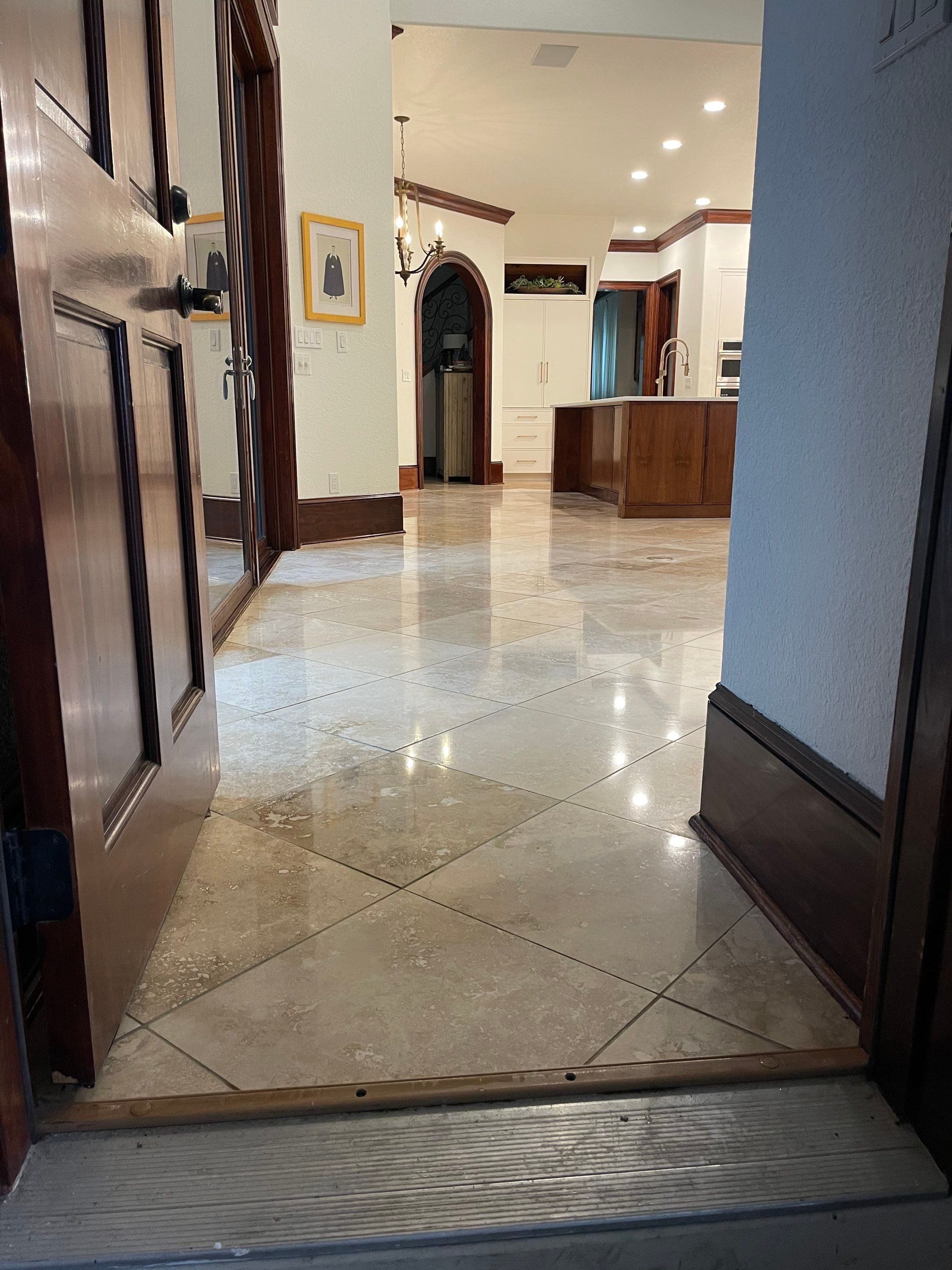 Polished Travertine Floor Restoration for Gulf Shores Residence by Cornerstone Hard Surface Restoration