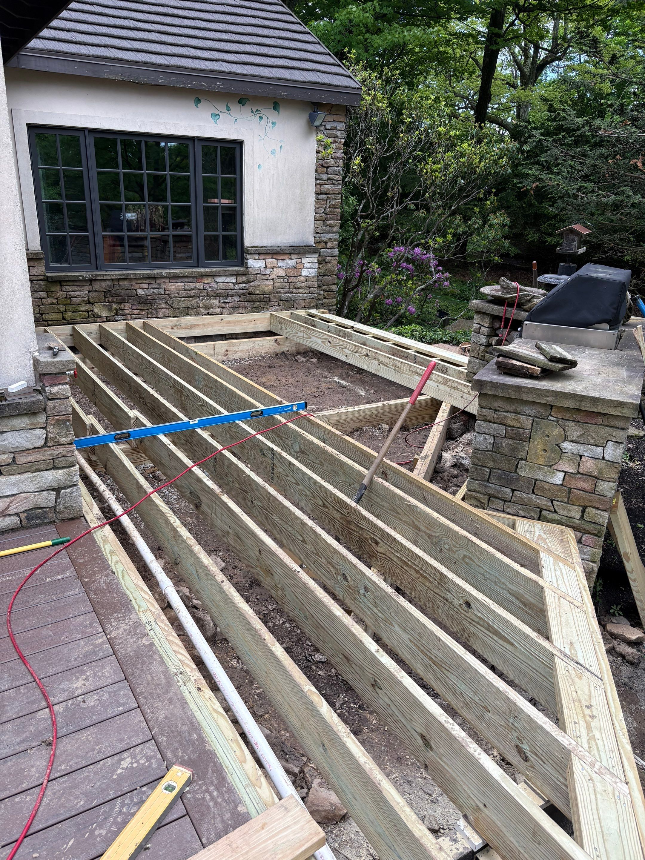 1500 sq/ft Composite Deck Build with Outdoor Kitchen in Champion by Cousins Roofing Siding & Decks