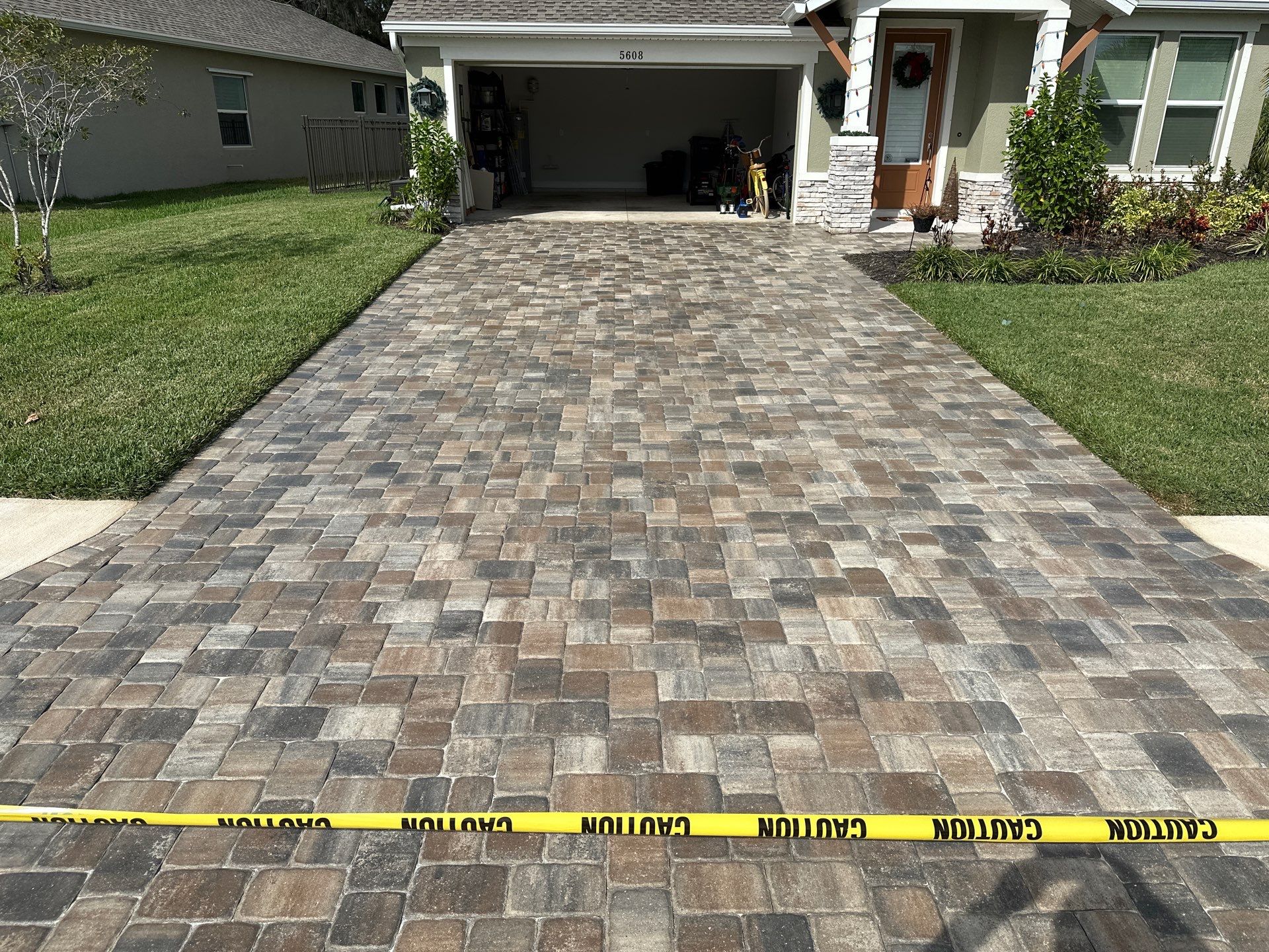 House Wash, Paver Driveway & Sidewalk Cleaning + Sanding & Sealing in Trevesta Community, Palmetto, FL by Sunshine AquaWash