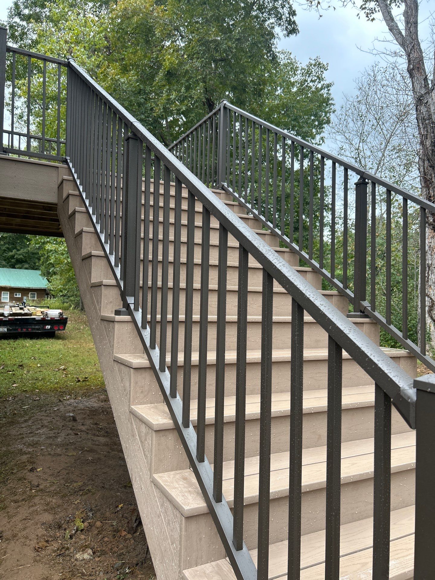 Log Cabin Wrap-Around Deck and External Staircase Installation in Caldwell by Walnut Hollow Decks & Outdoor Living