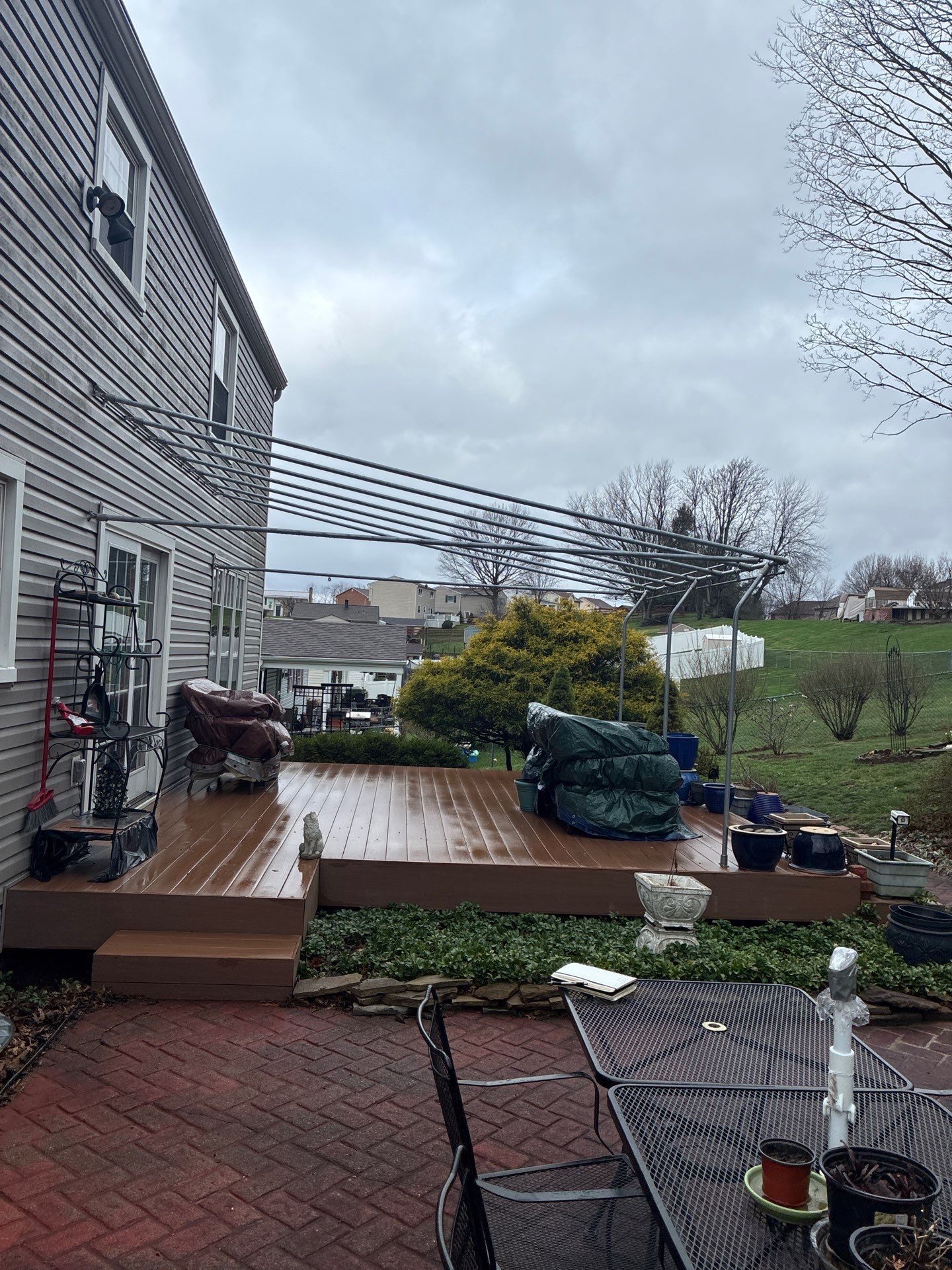 Composite Deck Build with Integrated Patio Cover in Washington by Cousins Roofing Siding & Decks