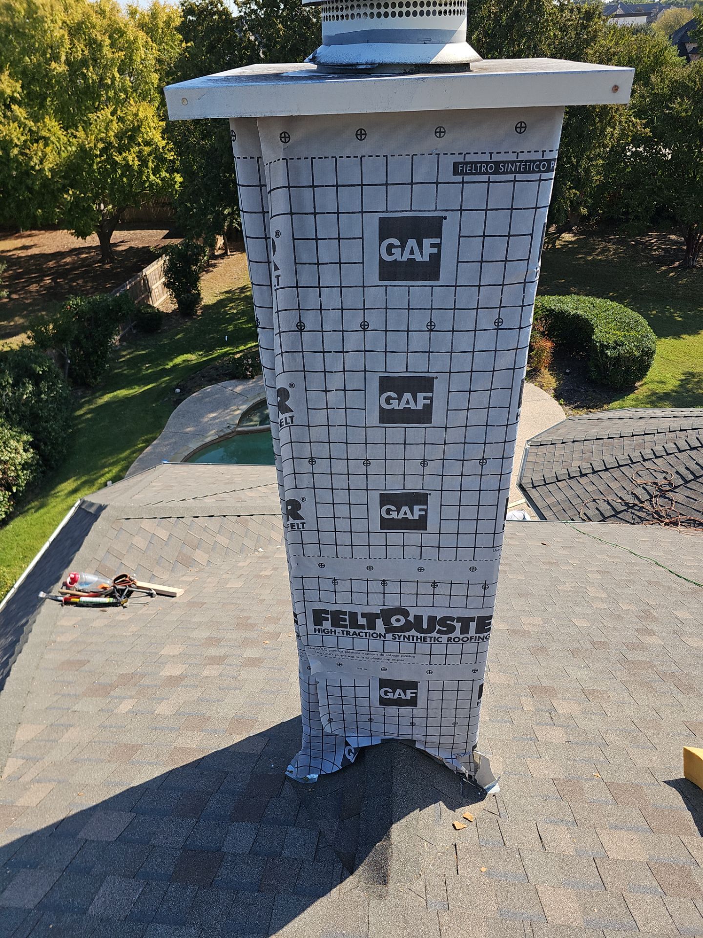 chimney repair using lap engineered treated composite siding. by road roofing llc