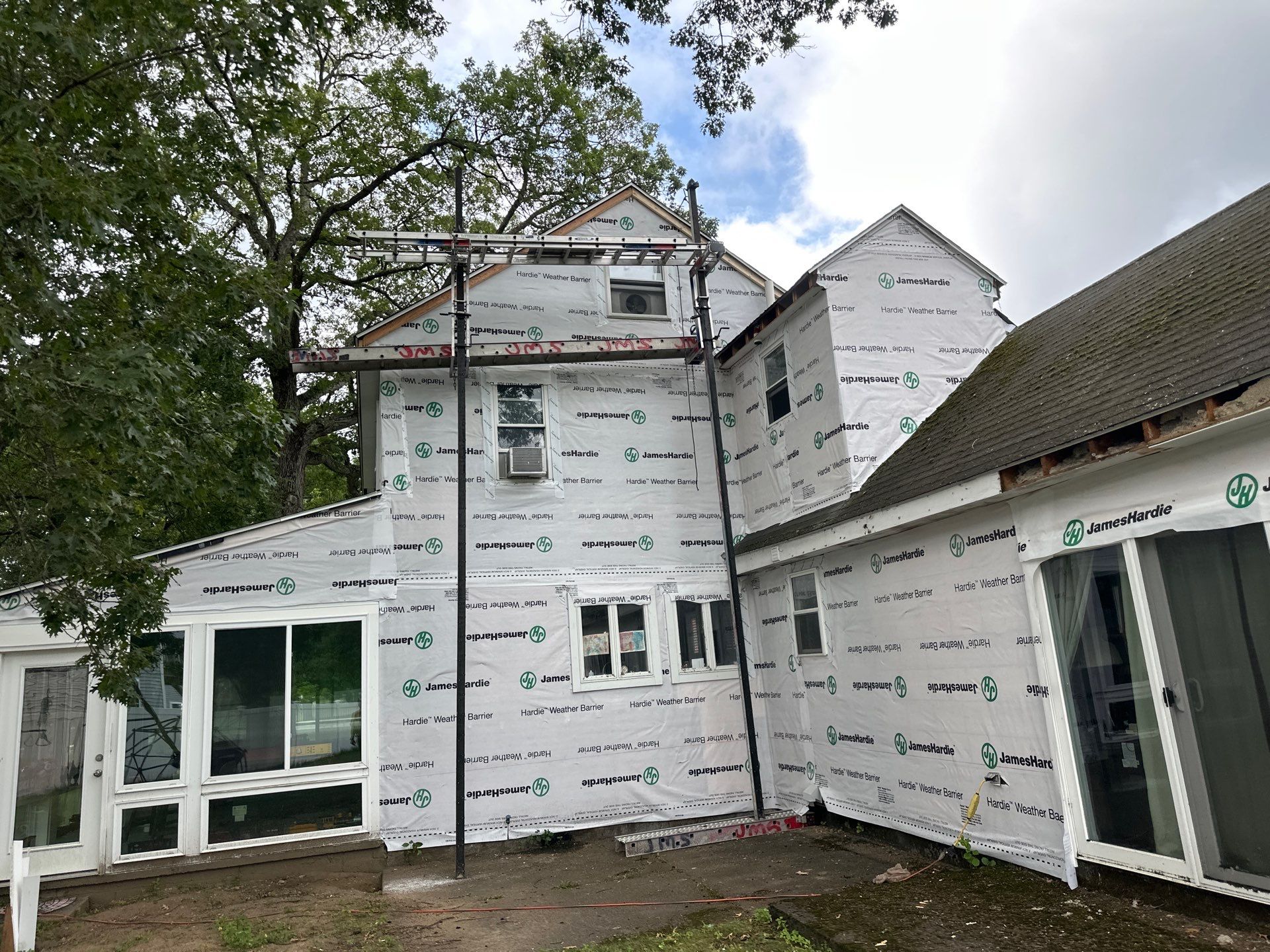 James Hardie Lap Siding Installation in Chelmsford, MA by Mighty Dog Roofing of Greater Middlesex County