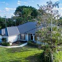 24ga 1.5" Mechanical Seam Dark Bronze by Total Roofing System The Metal Roof Experts
