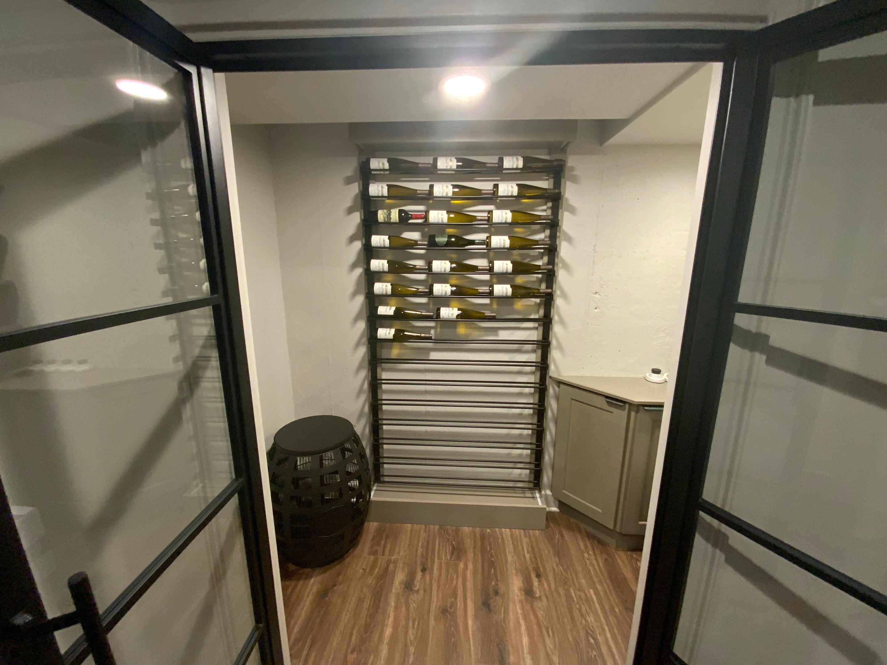 Finished Basement Renovation Featuring Home Theater and Custom Wine Cellar by Swift Home Renovations