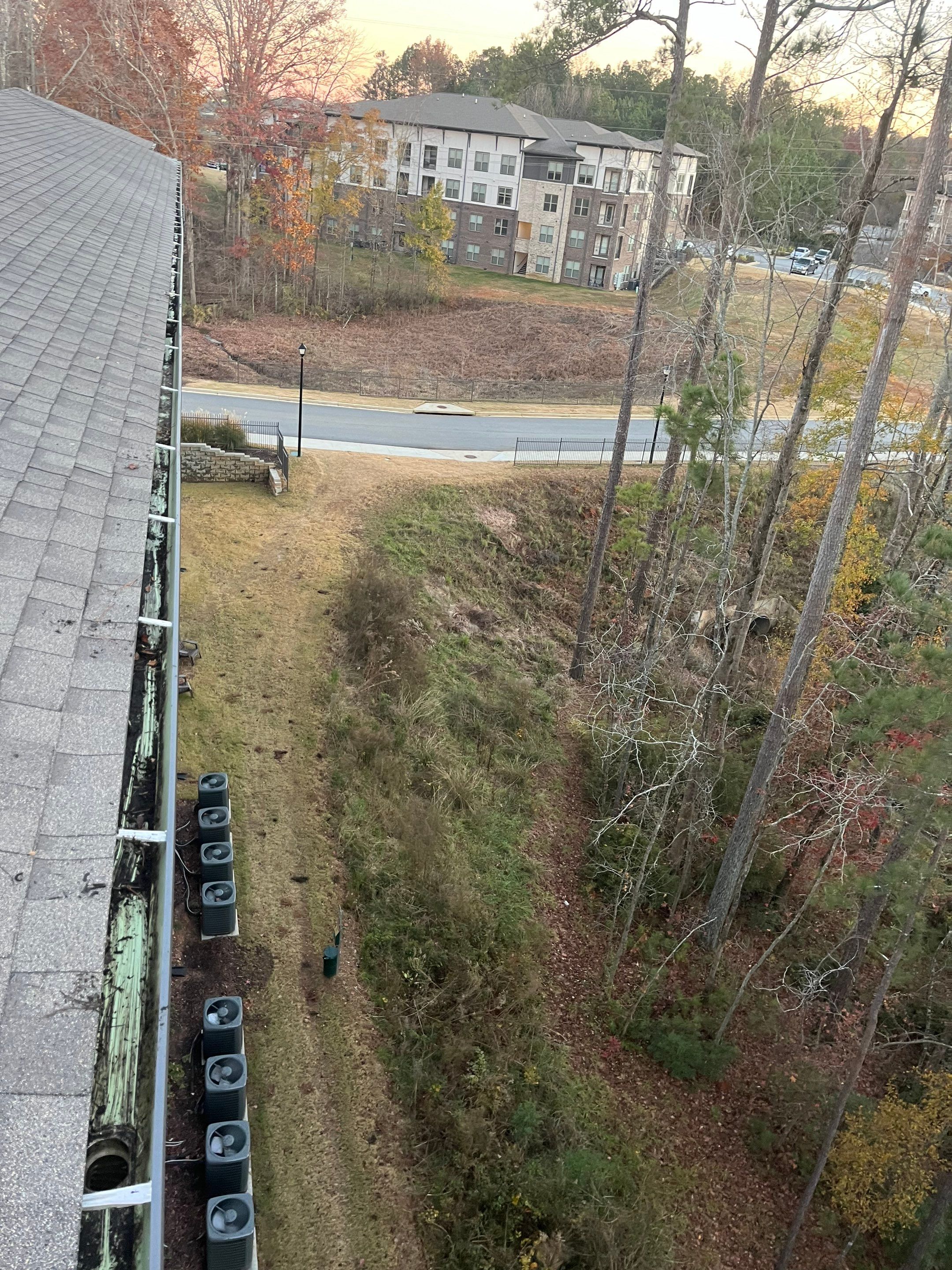 HOA gutter cleaning in Newnan, GA, after  photo showing full gutters.