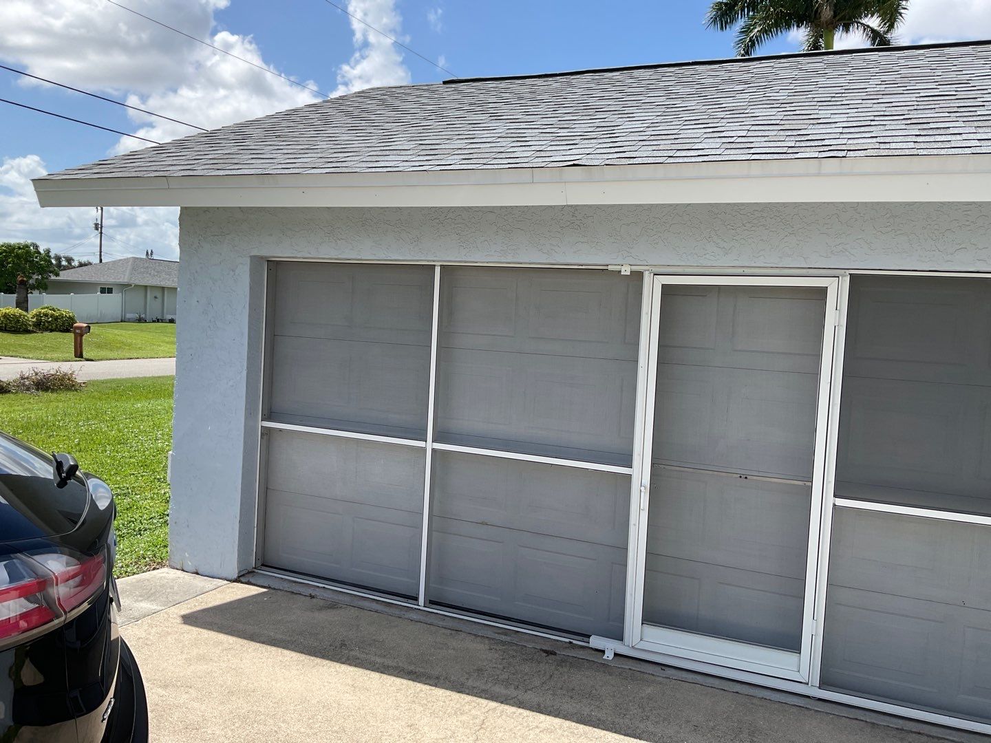 New White Seamless Gutters with Downspouts and Splash Guards in Cape Coral FL by Gutter Professors