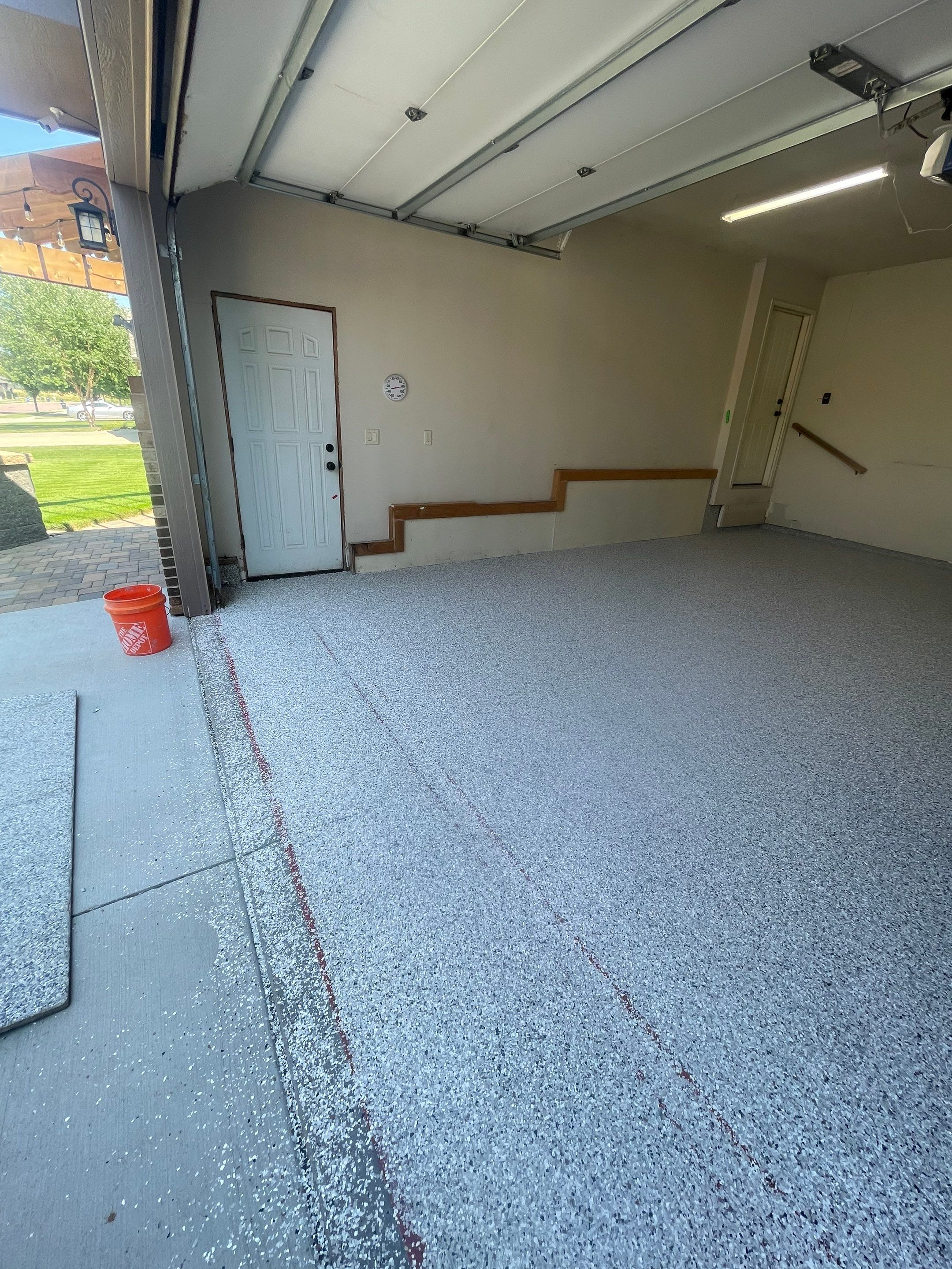 Multi-Stall Garage Floor Coating Installation in Sioux Falls by Select Painting, Coatings & Garage Cabinets