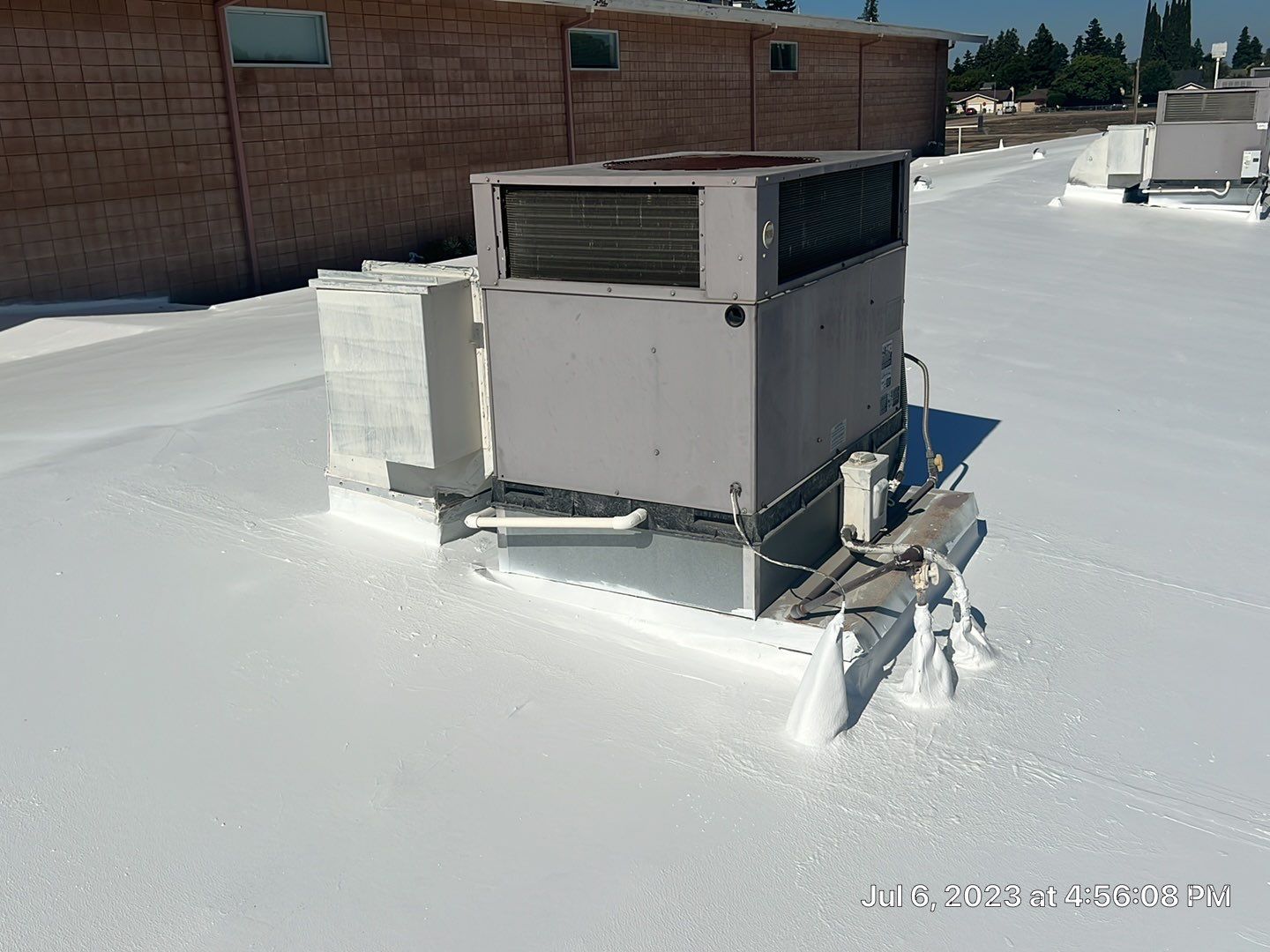 MR Roofing system using Benchmark/PUMA XL coatings over TPO single-ply roofing by Straight Edge Roofing Inc