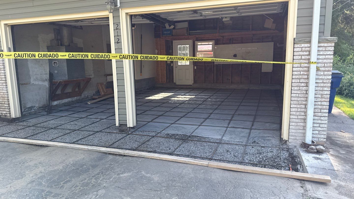 Concrete garage floor replacement  by NG Masonry & Construction LLC