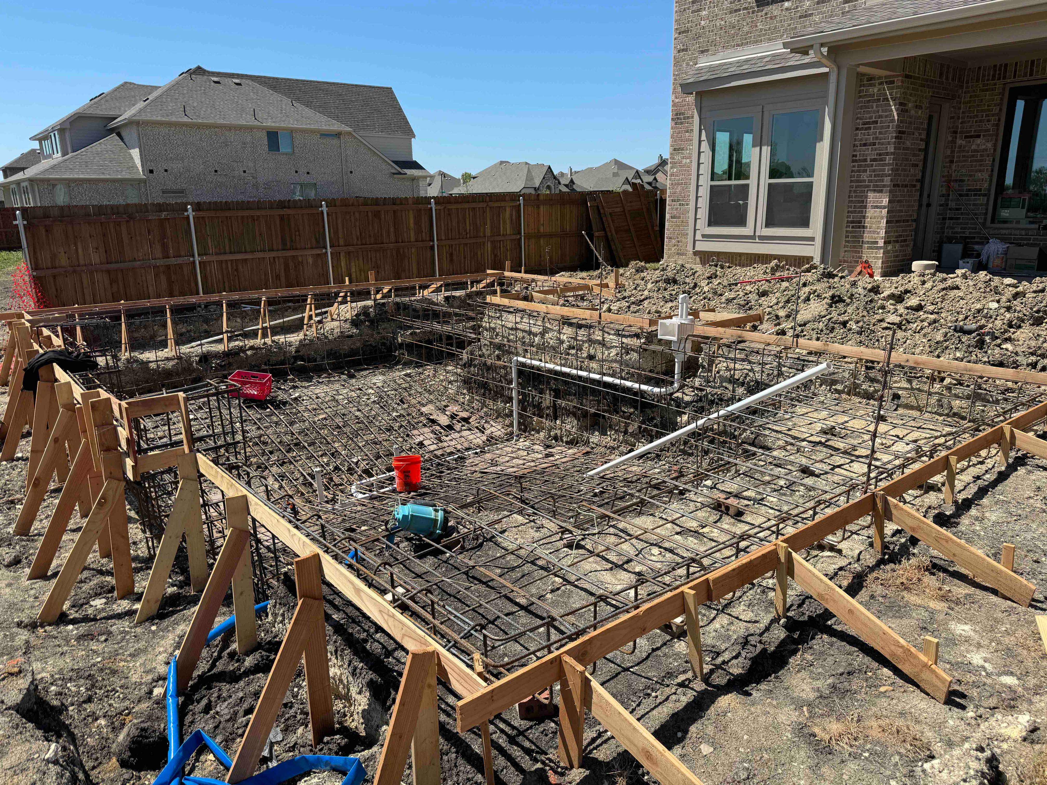 Geometric Pool with Tanning Ledge and Turf Accents by Pinnacle Pools and Spas - DFW