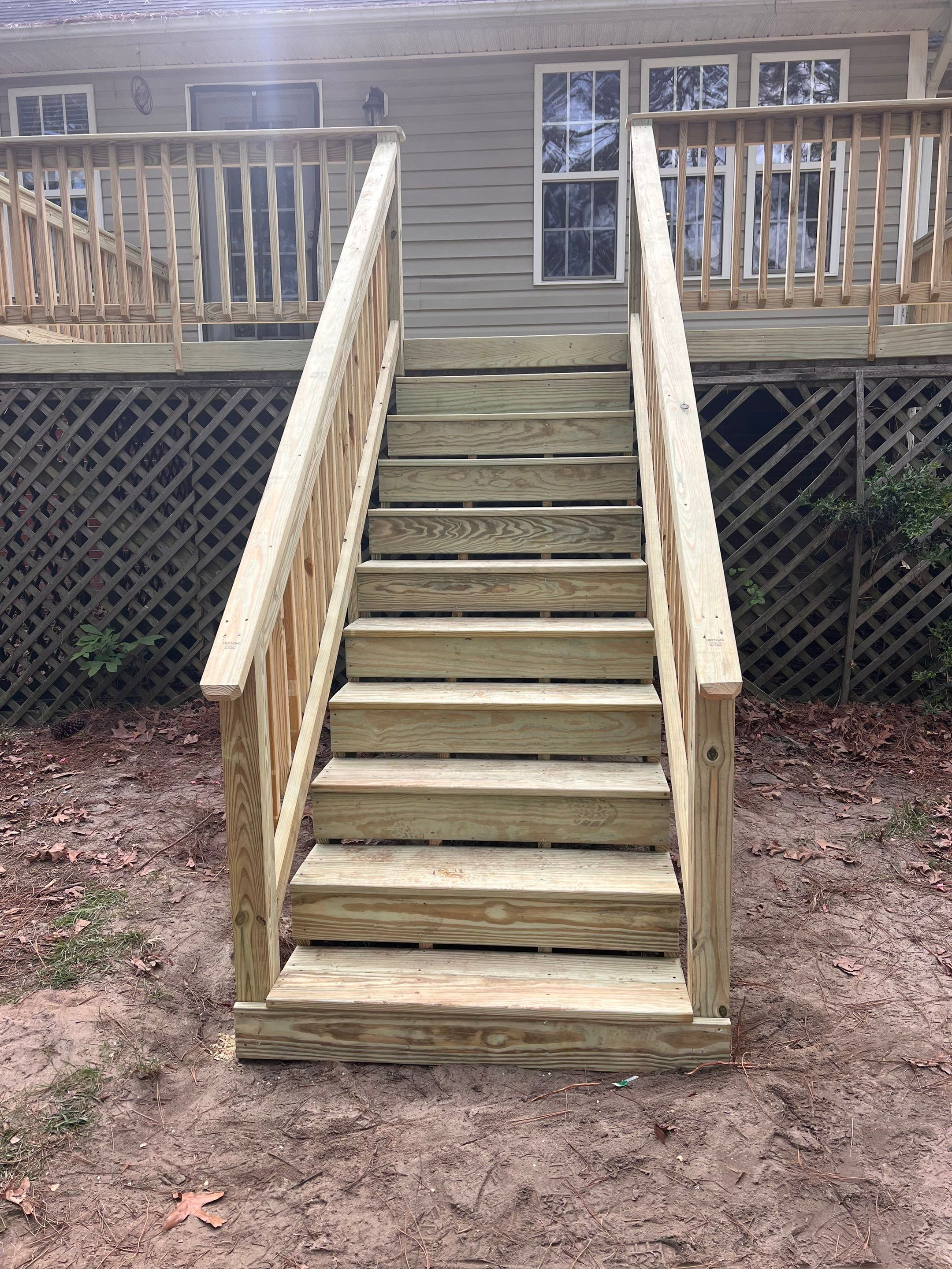Pressure-Treated Wood Deck Resurface and Stair Replacement in Sanford by The Remodeling Company
