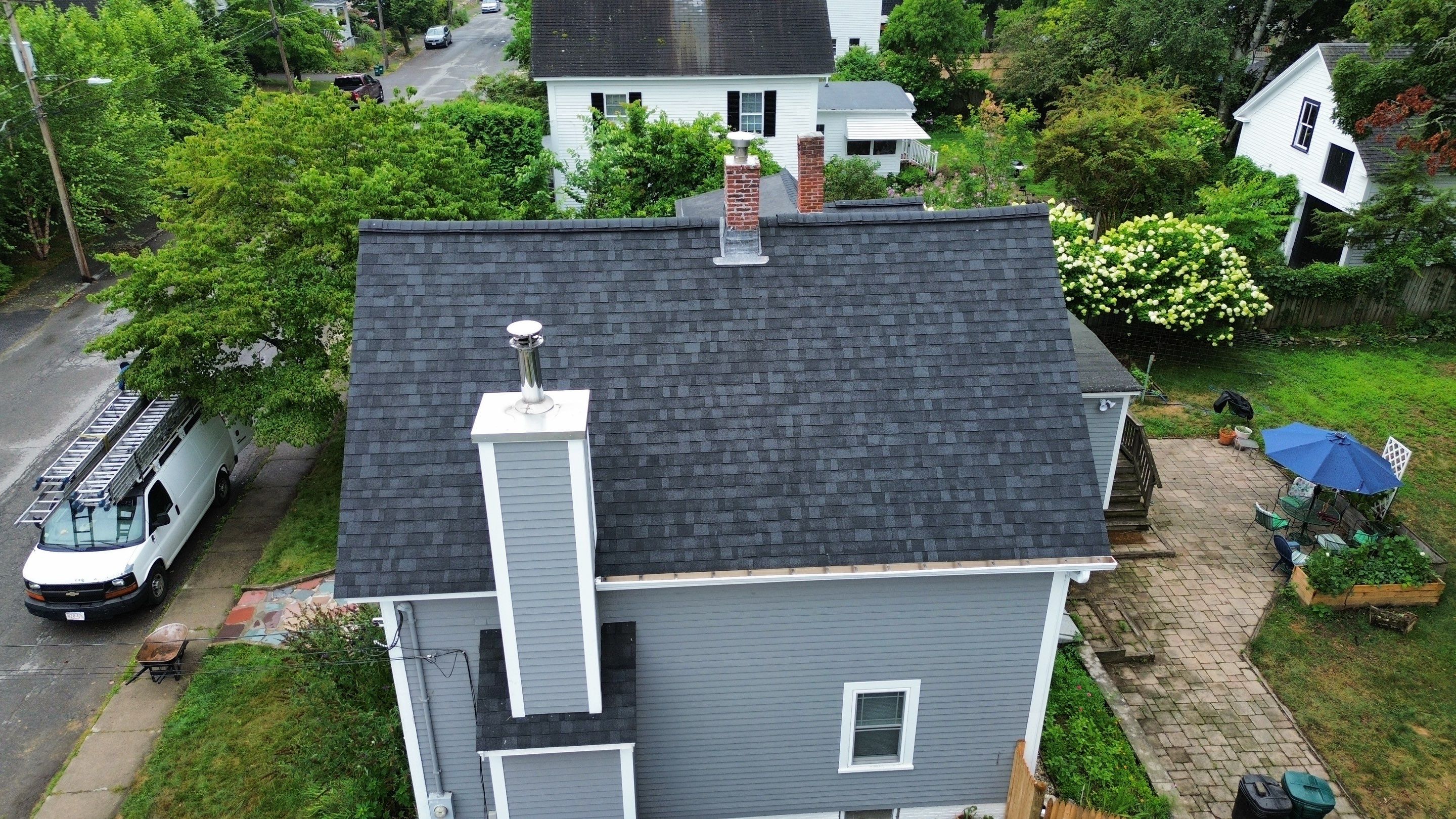 Full Roof Replacement + Custom Gutter Install | Onyx Black Finish by Mighty Dog Roofing of Greater Middlesex County