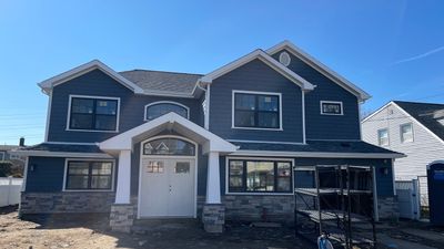 Full House Installation 5" white seamless gutters 2x3 leaders