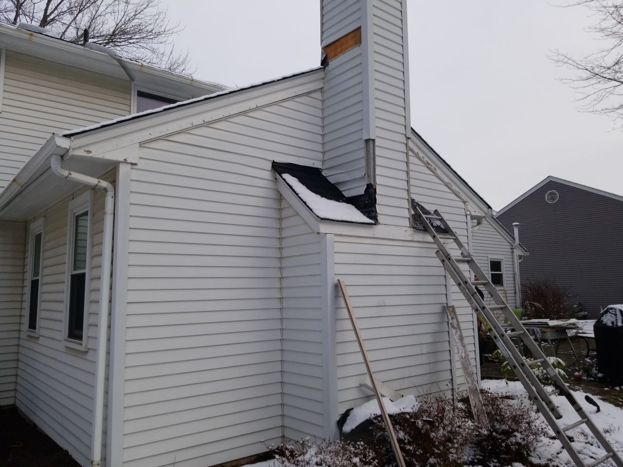 James Hardie Siding  using James Hardie Board and Batten, White by Absolute Roofing and Construction