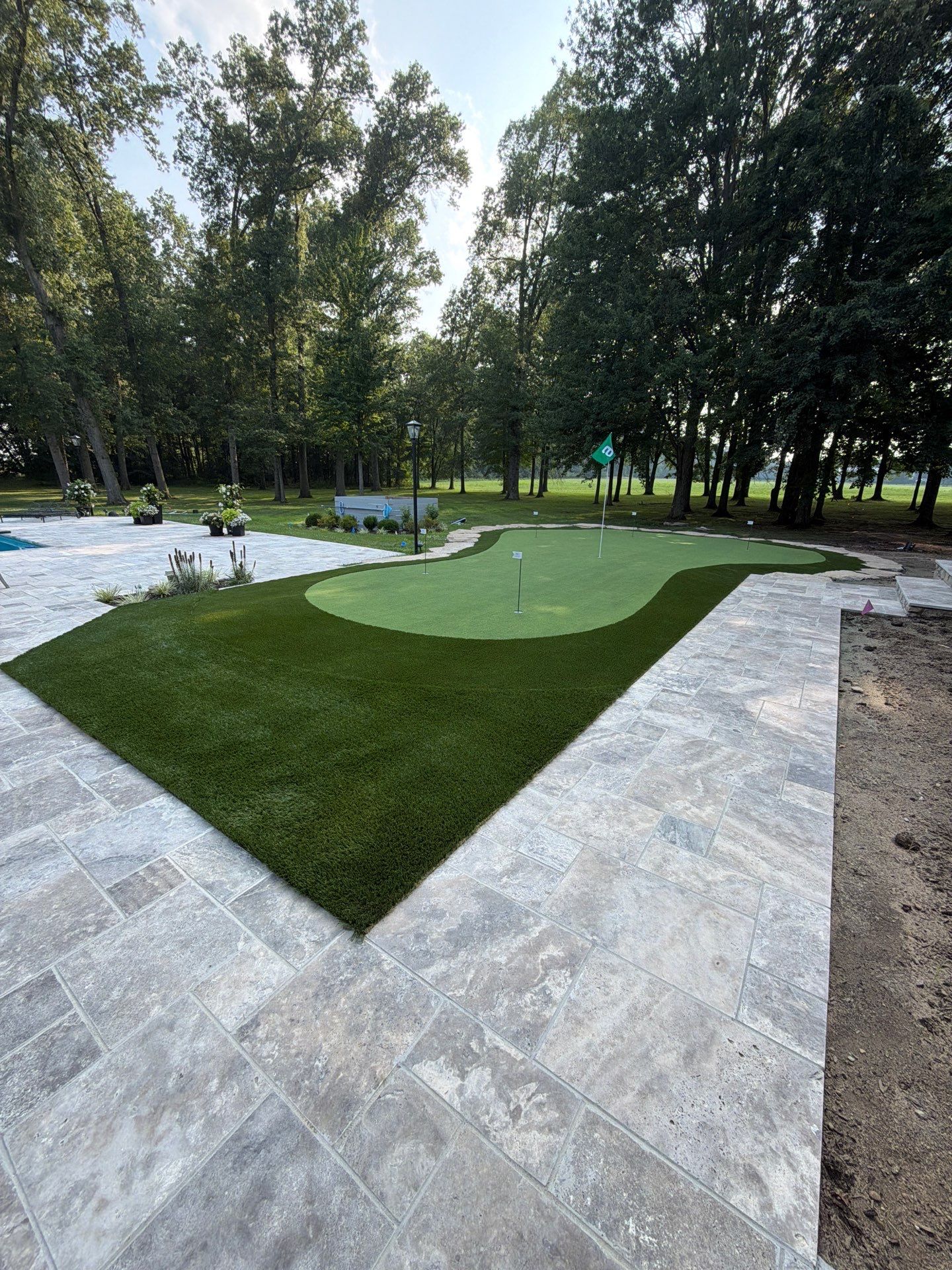 Custom Backyard Golf Green Accented by Flagstone Border in Morrow, OH by Southwest Greens Midwest