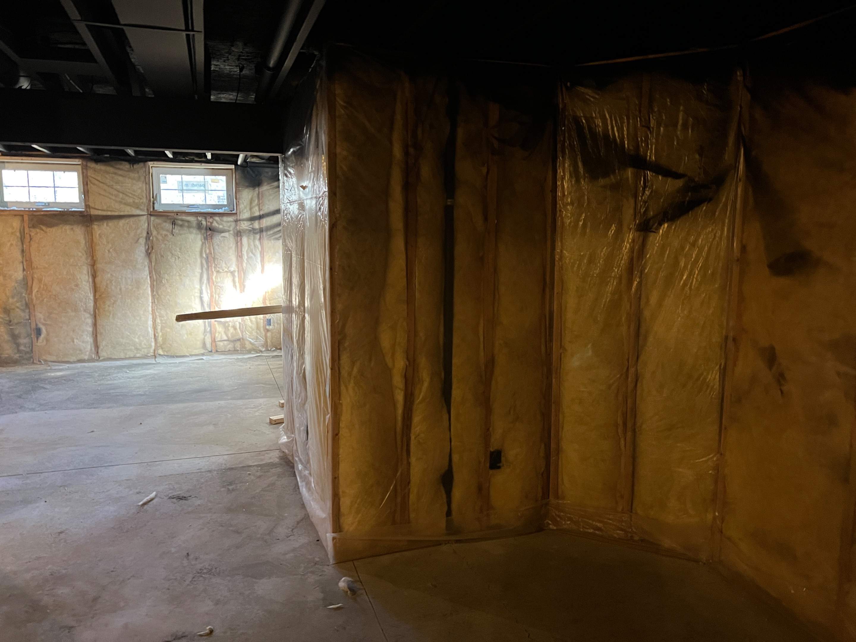 Basement Remodel w/ LVP Flooring & Exposed Ceiling by Chagnon Building & Remodeling LLC