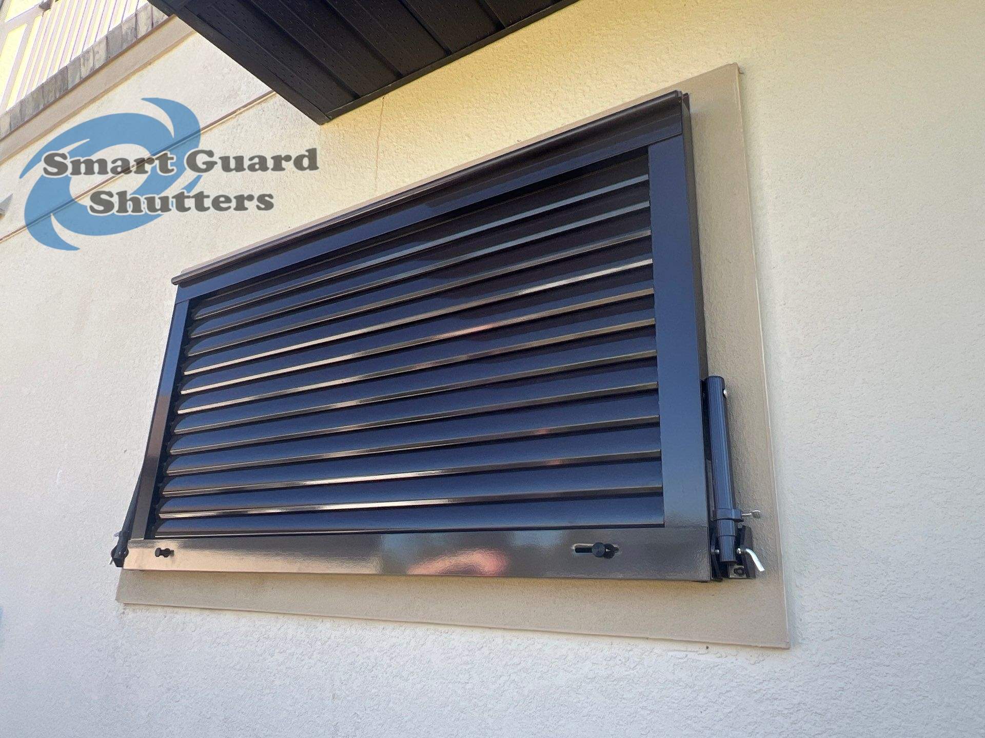 Impact Bahama Shutter in Grey Brown by Smart Guard Shutters