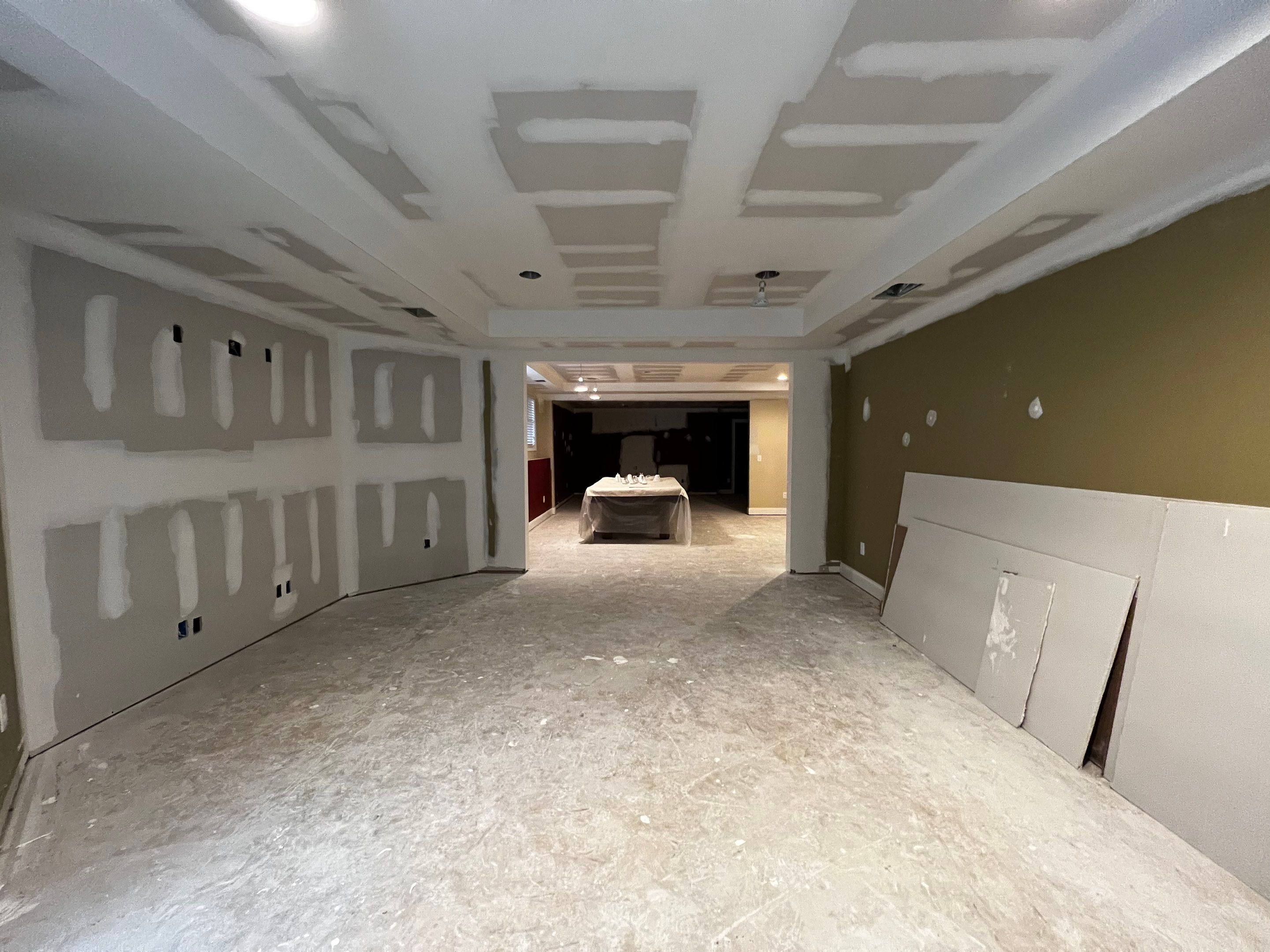 Modern Basement Remodeling in Woodstock with Custom Live-Edge Bar by Swift Home Renovations